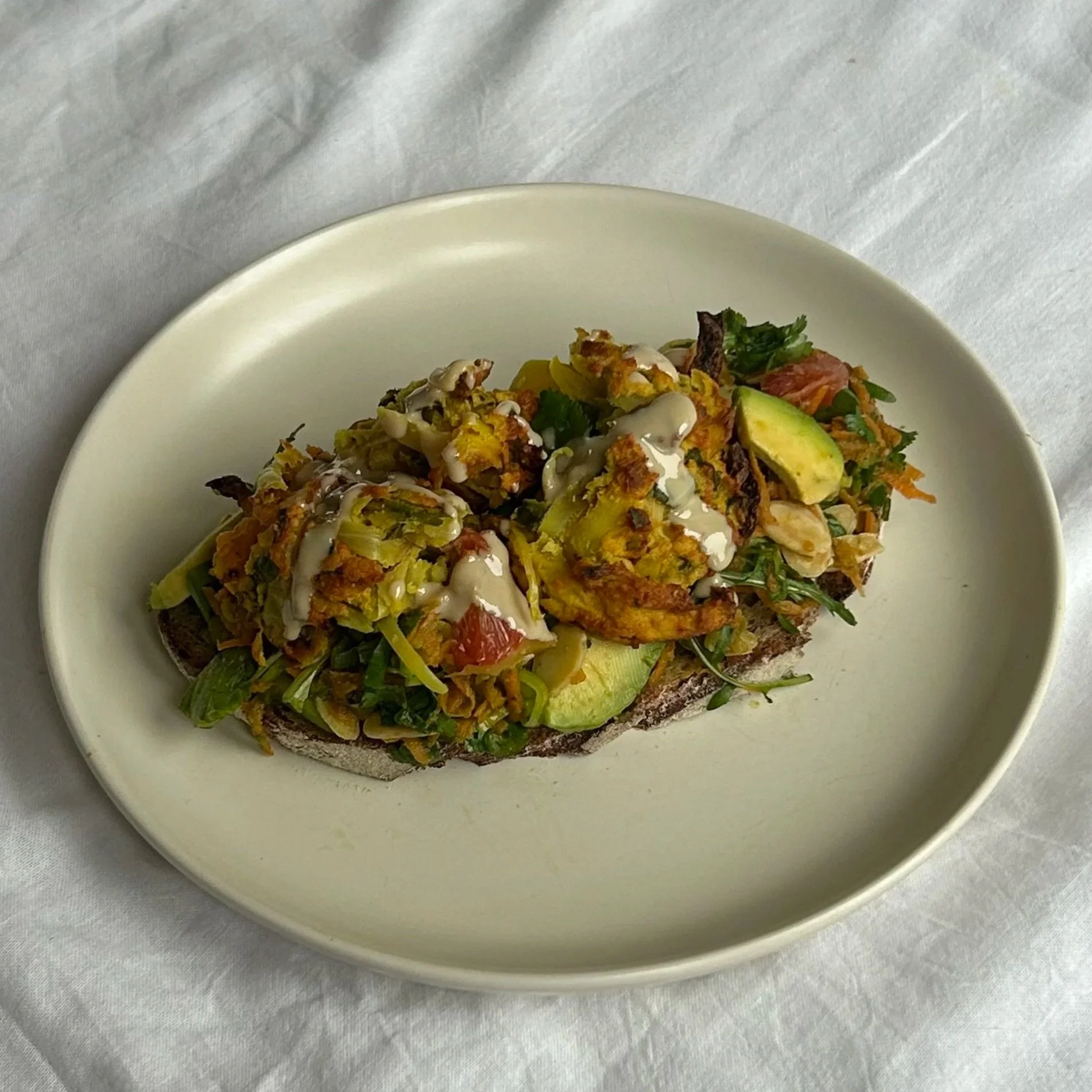 Spiced potato red lentil fritter &amp; salsa verde salad toast