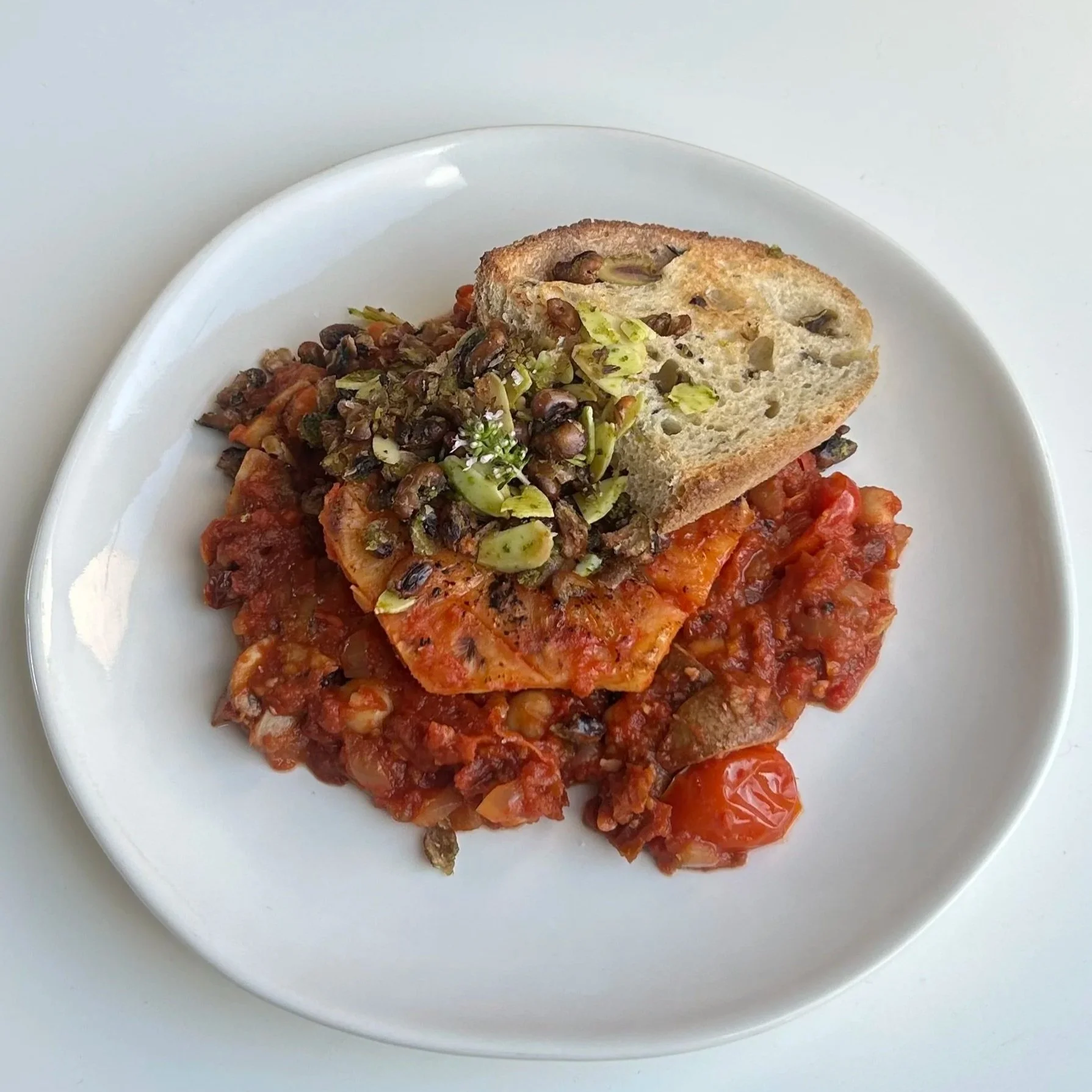 Smoky tomato braised celeriac &amp; crunchy pesto beans