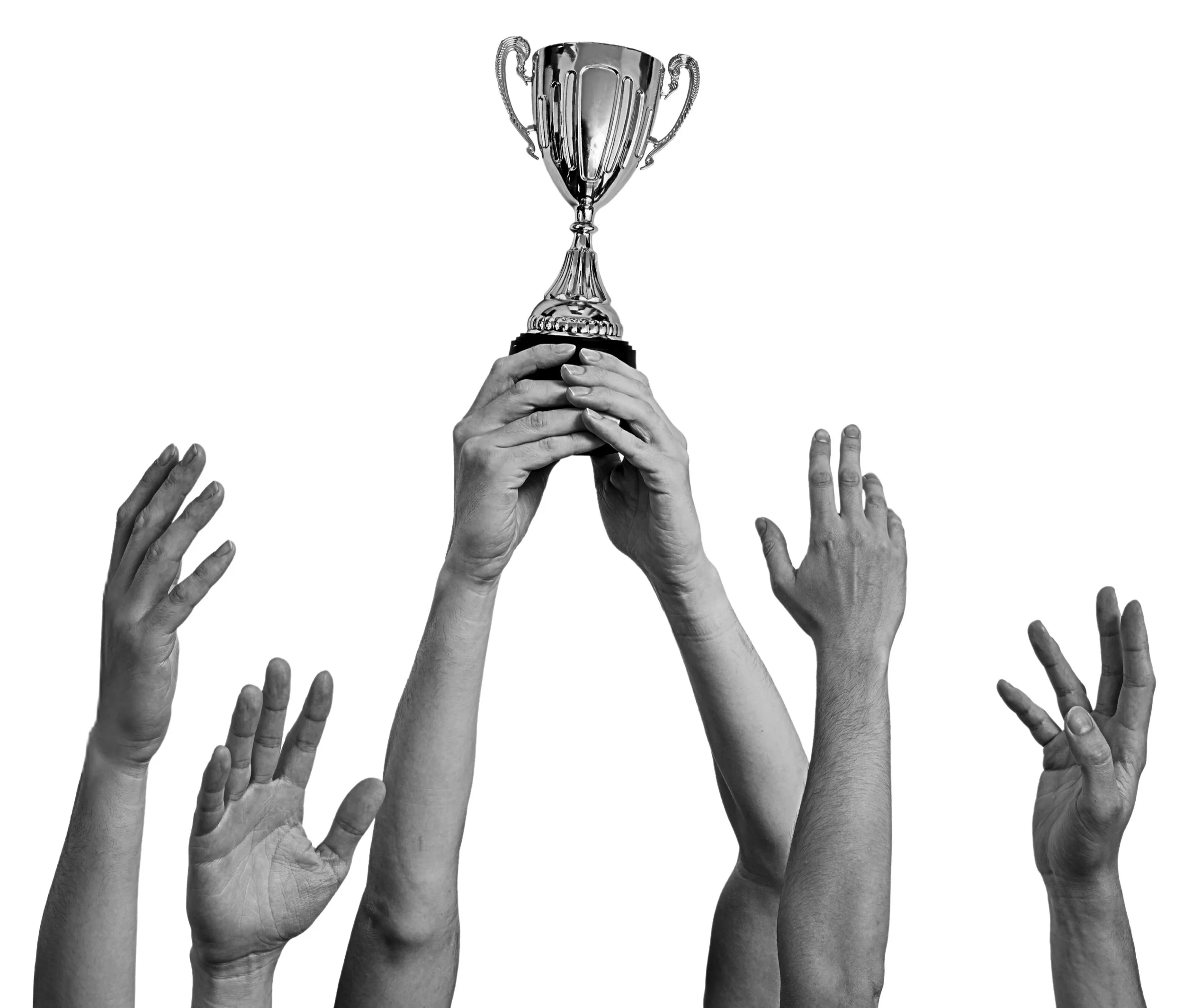 Several hands reaching for a trophy