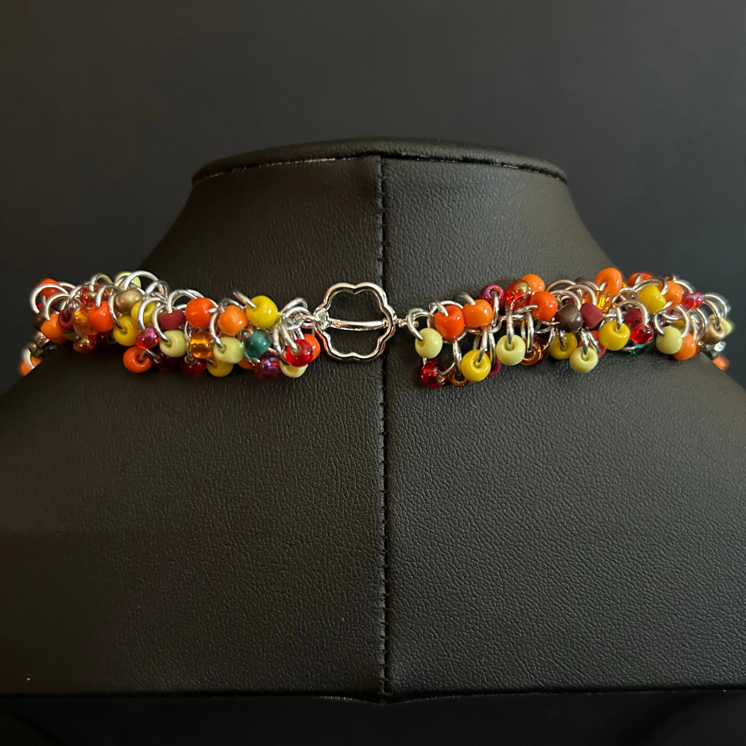 “Close-up of the silver toggle clasp and connecting rings.”