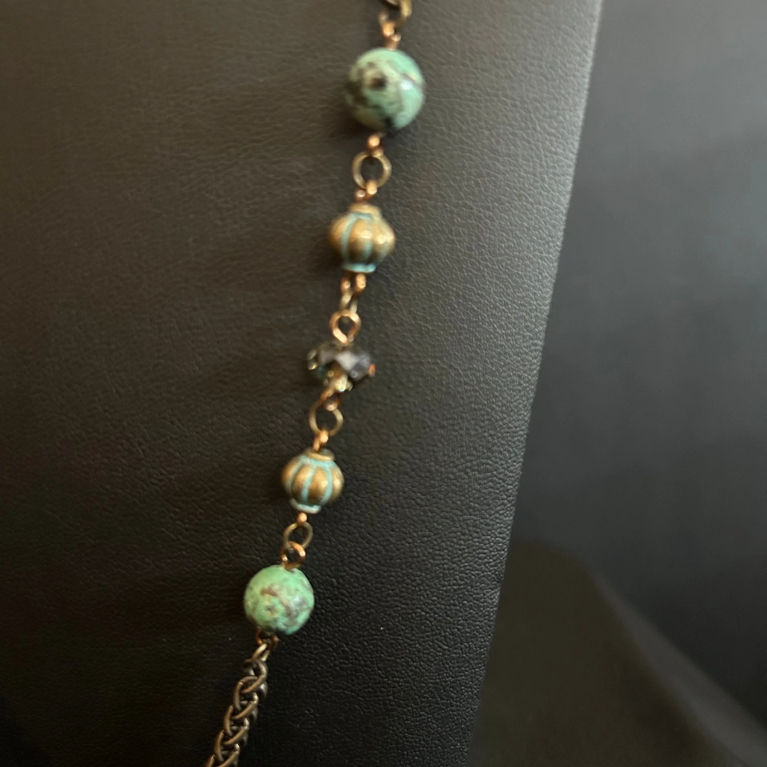 “Detail of the bronze chain links and African Turquoise beads.”