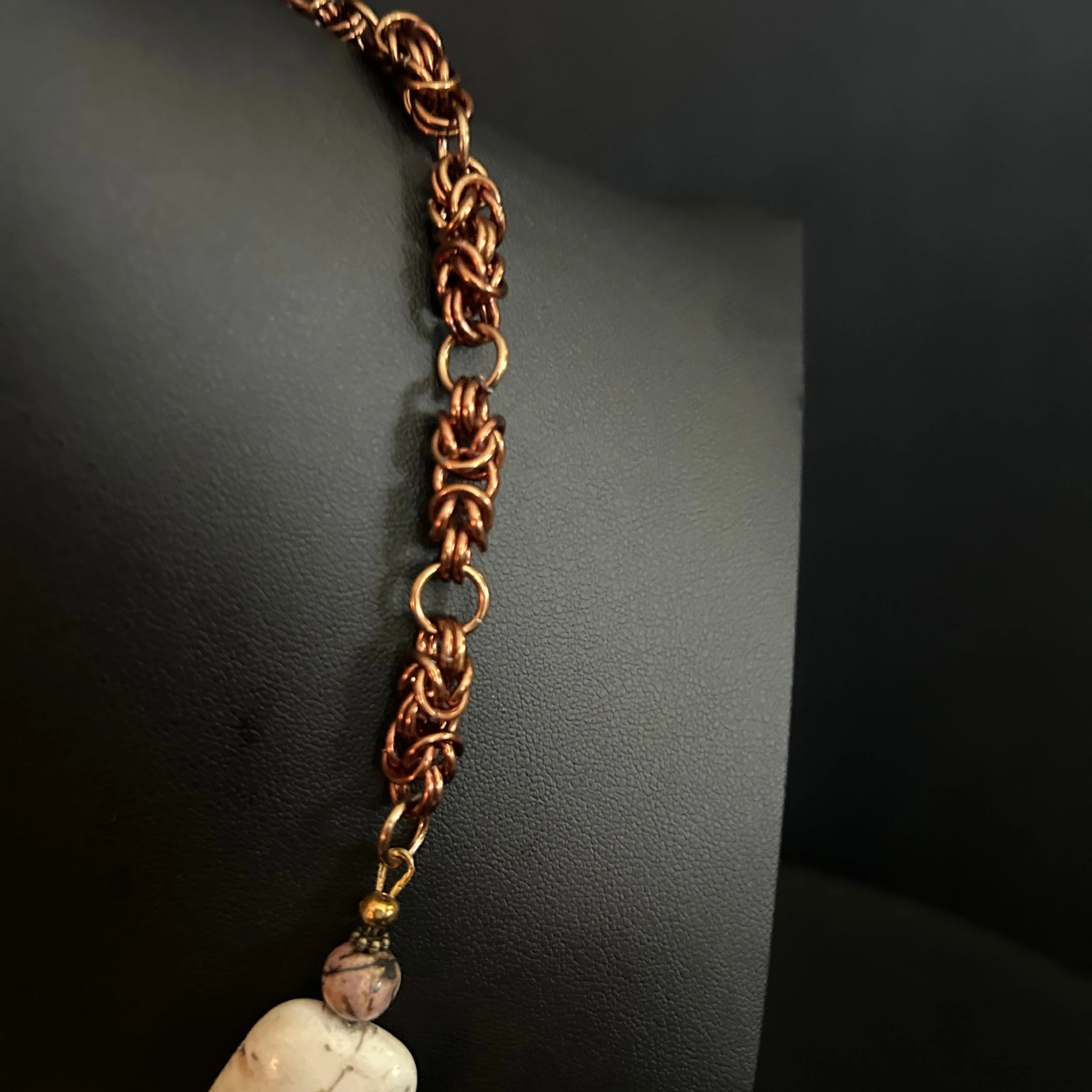“Detail of the bronze‑finish Byzantine chainmaille weave.”