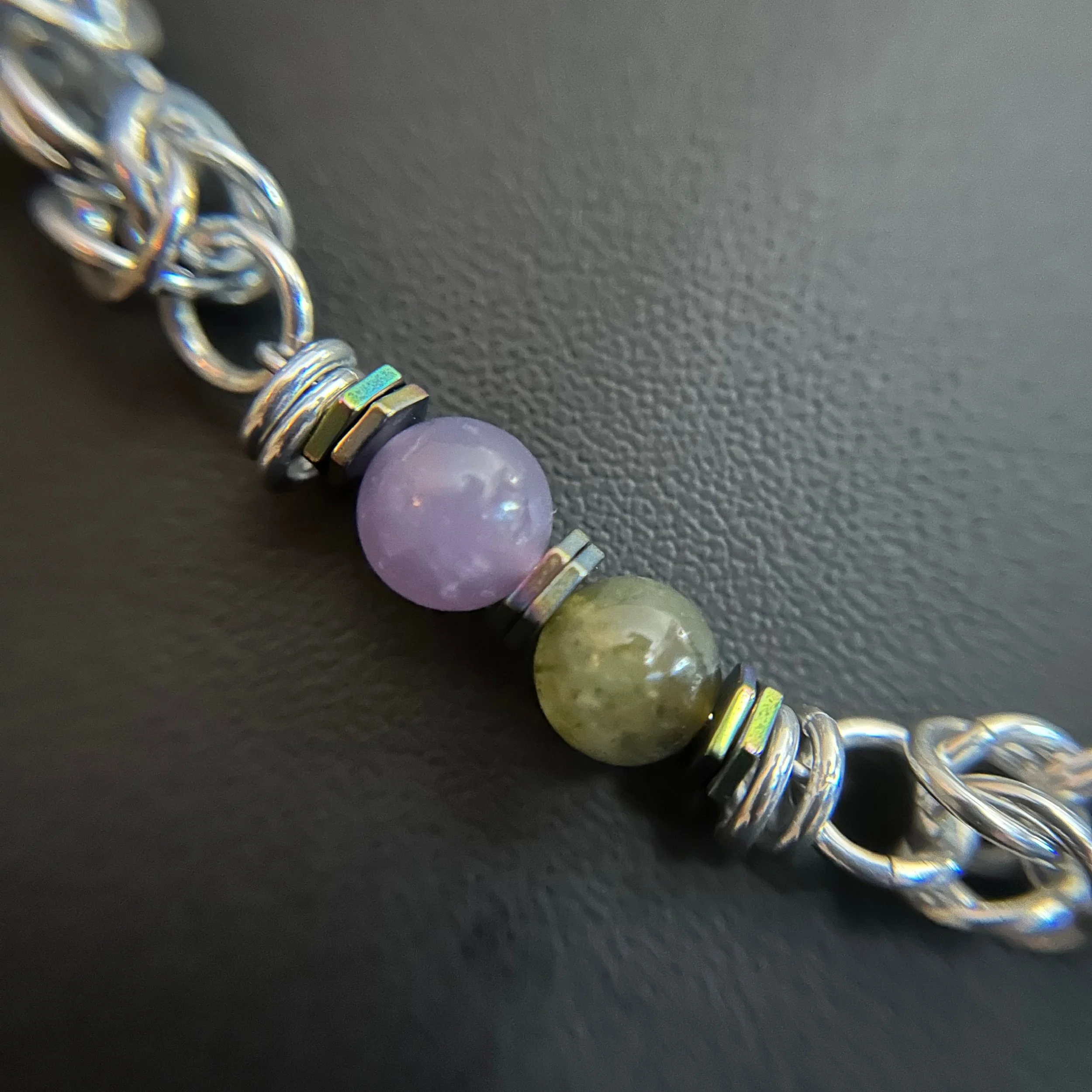 “Close-up of the labradorite and lepidolite stones with hematite spacer accents.”