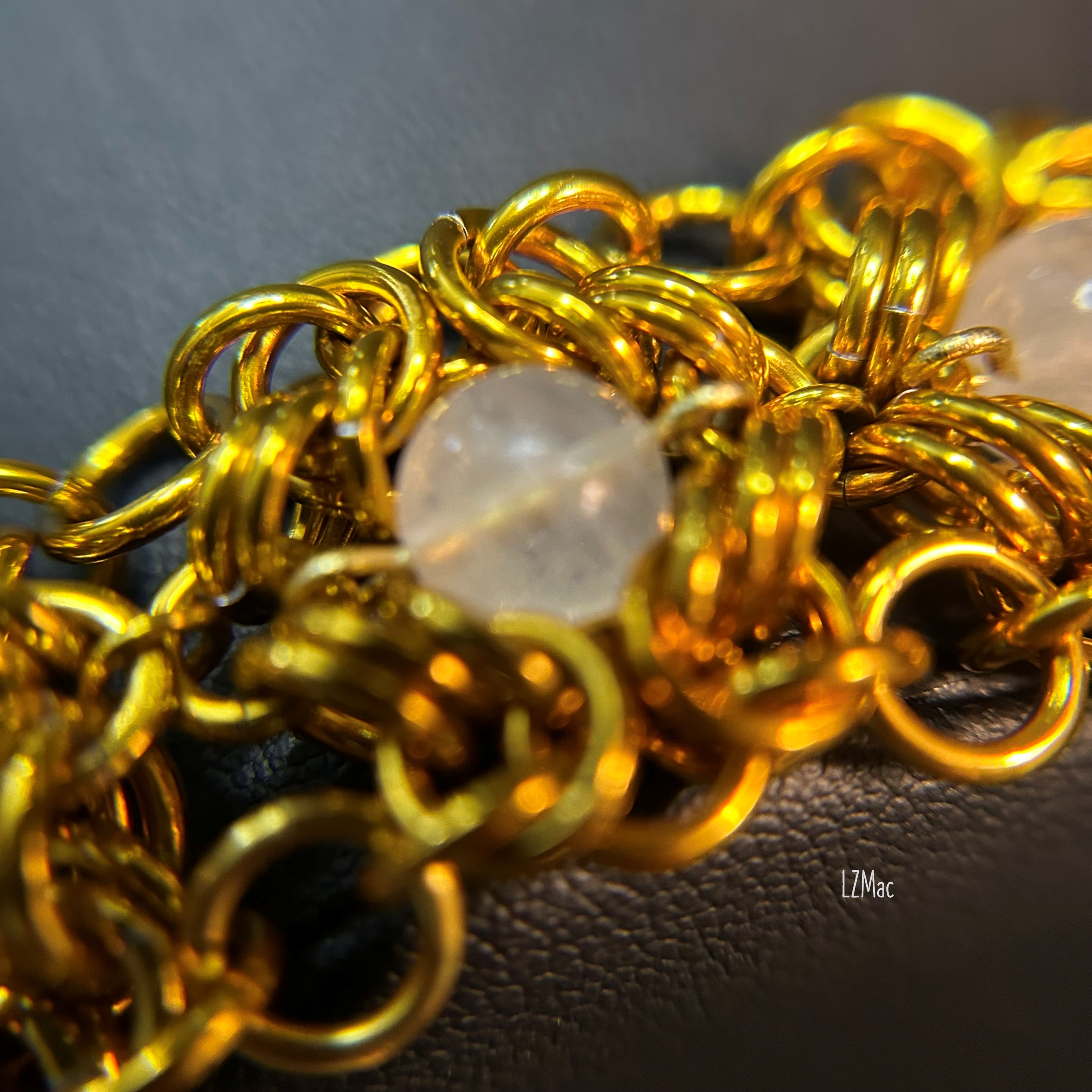 Close-up of the Moonlit Rosette Bracelet showing the detailed Byzantine rosette weave and 8mm moonstone bead glow.
