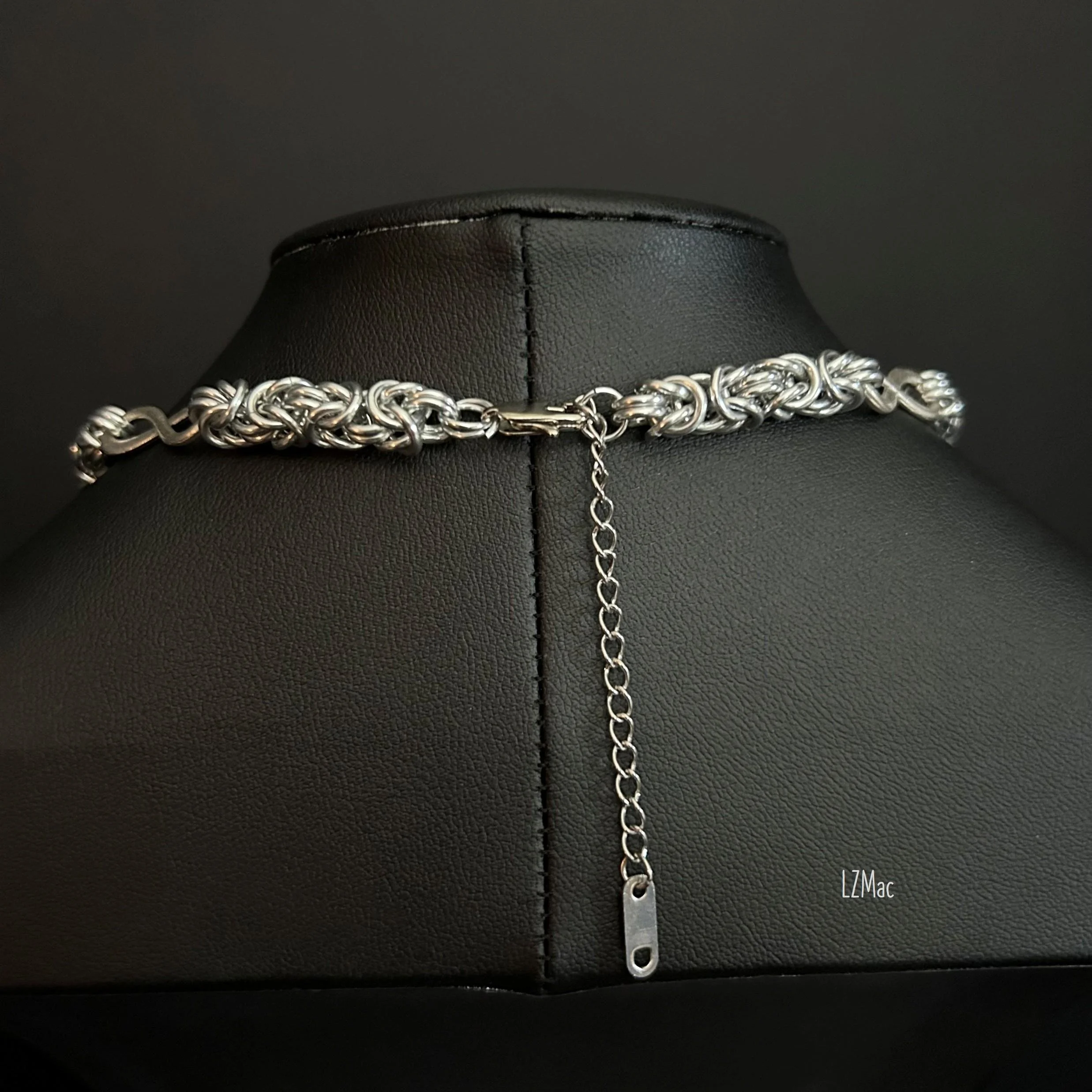 Stainless steel clasp and 3-inch extender chain on the Silver Infinity necklace with anodized aluminum chainmaille construction.