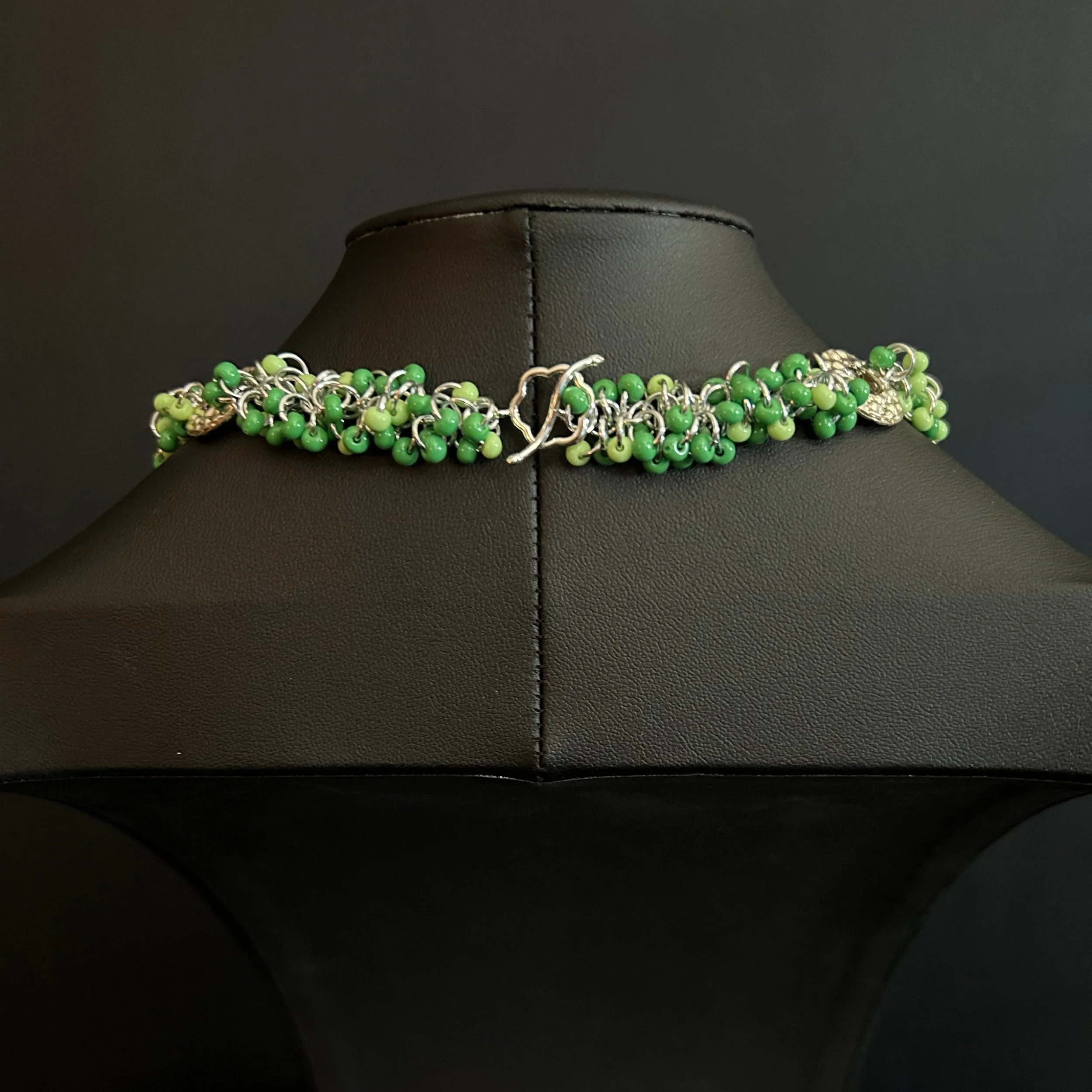 “Close-up of the silver toggle clasp and connecting rings.”