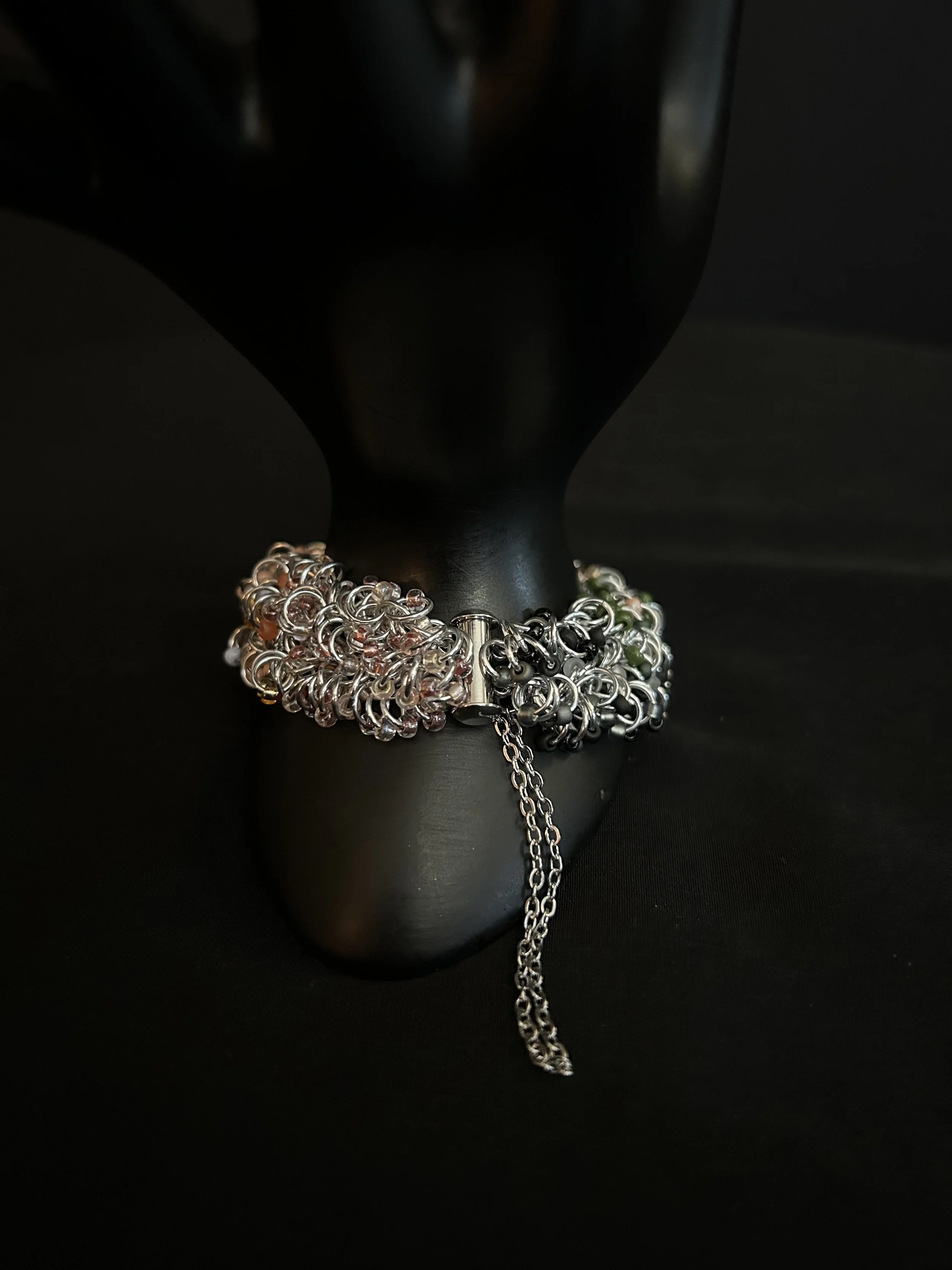 Close-up of the Blue Ridge Autumn bracelet’s stainless steel slide‑lock clasp and safety chain, highlighting the clean, secure hardware.