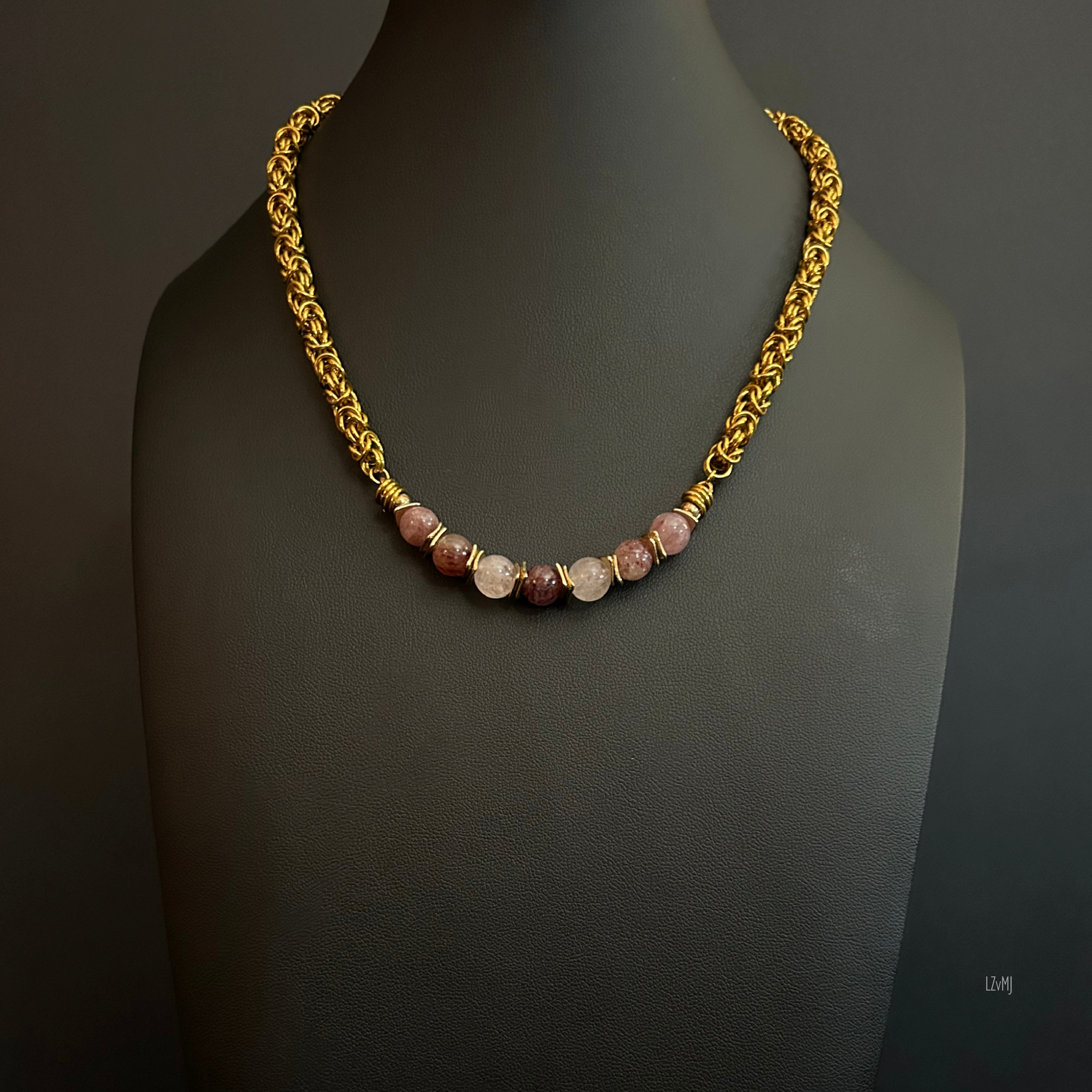 “Full view of the Strawberry Fields necklace with strawberry quartz beads, gold spacers, and gold‑tone chain.”