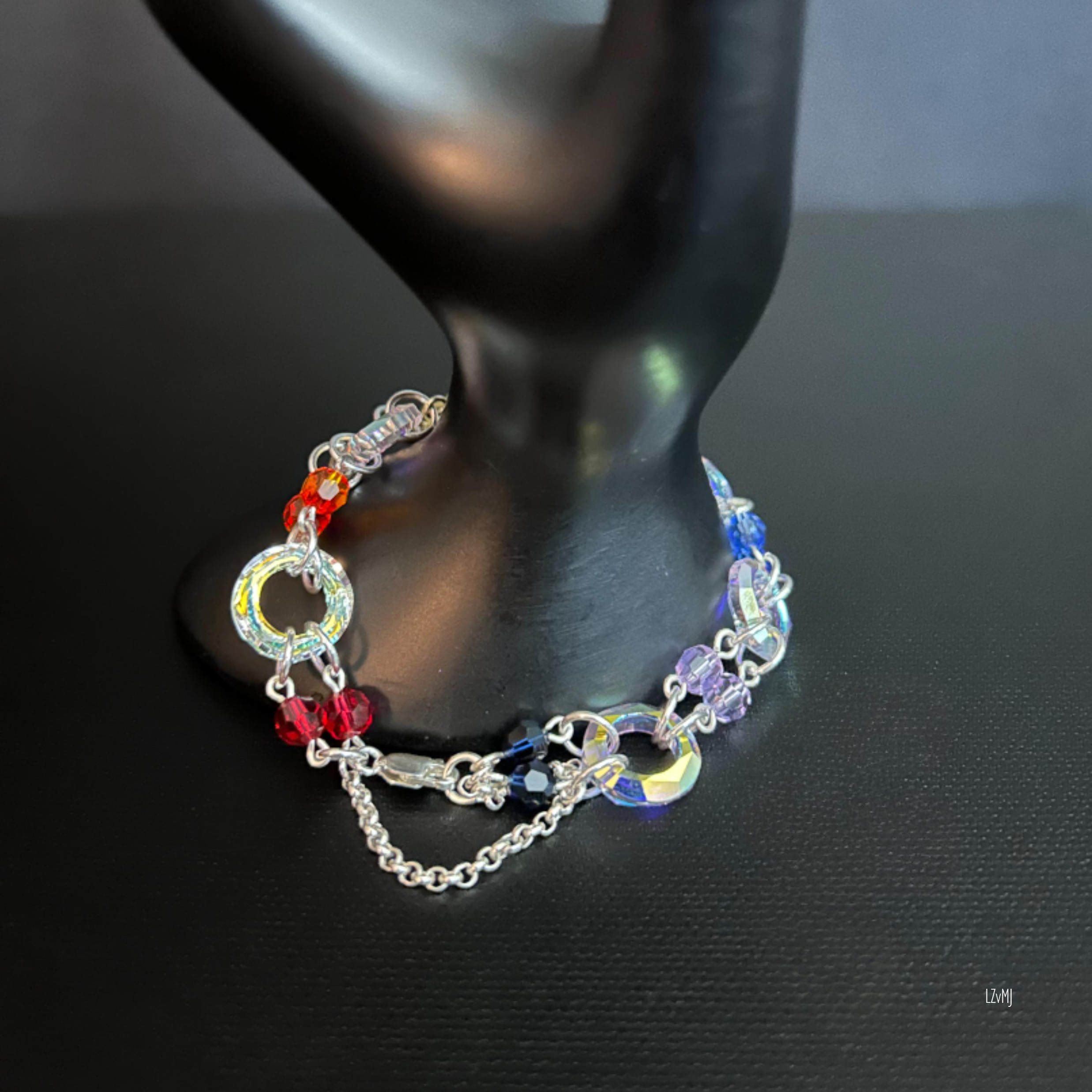 Close-up of the sterling silver clasp and safety chain, showing the clean connection points and polished finish