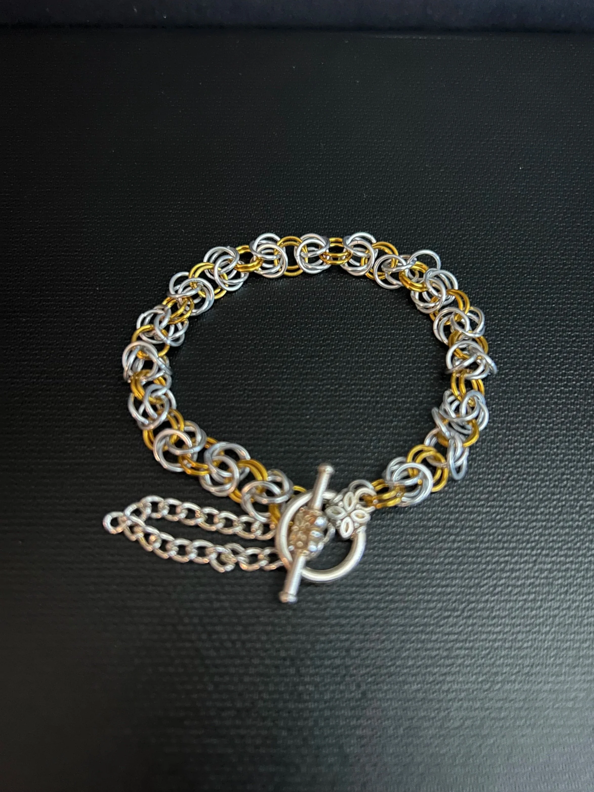 Silver and gold tone helm weave chainmaille bracelet