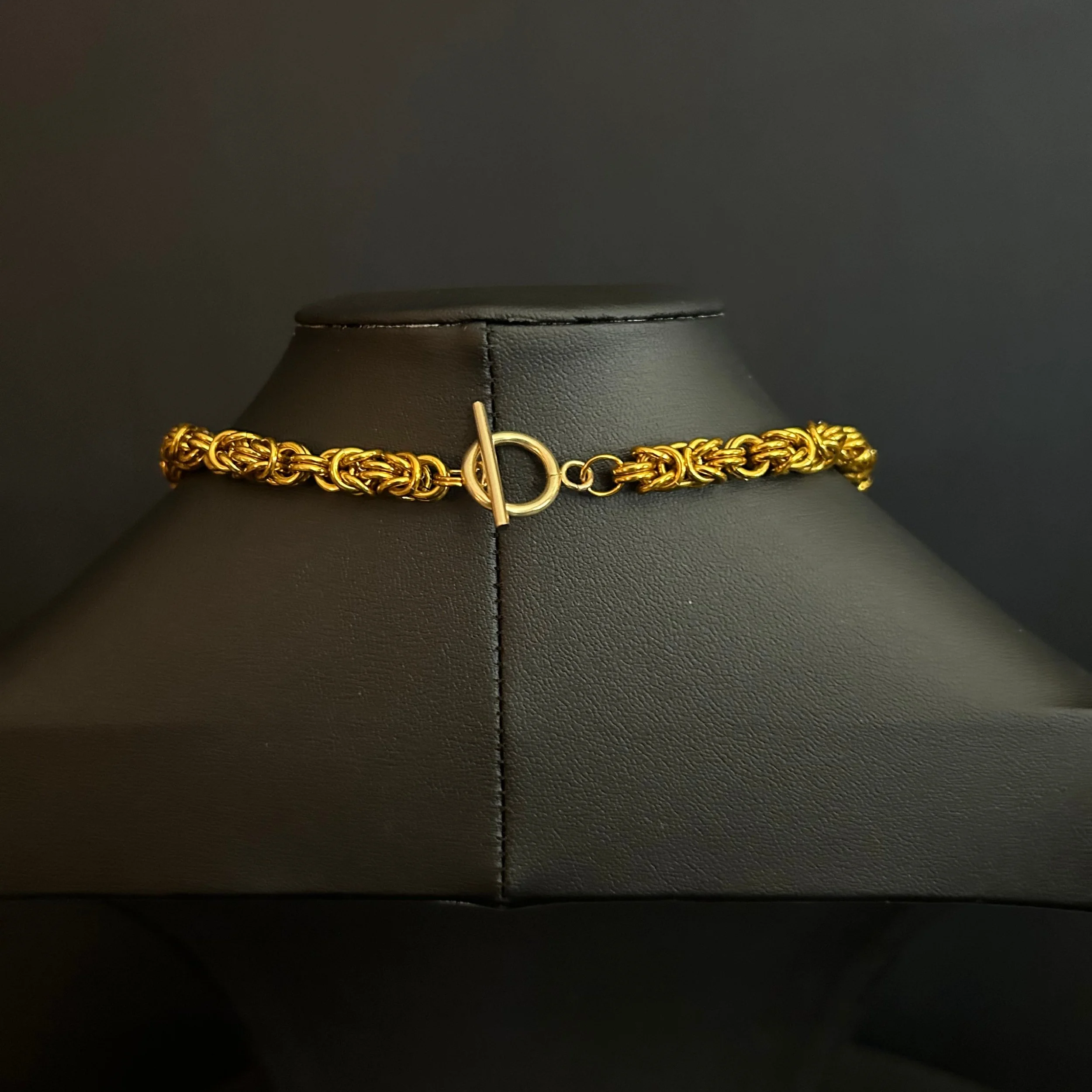 “Close-up of the gold‑tone toggle clasp and connecting rings.”