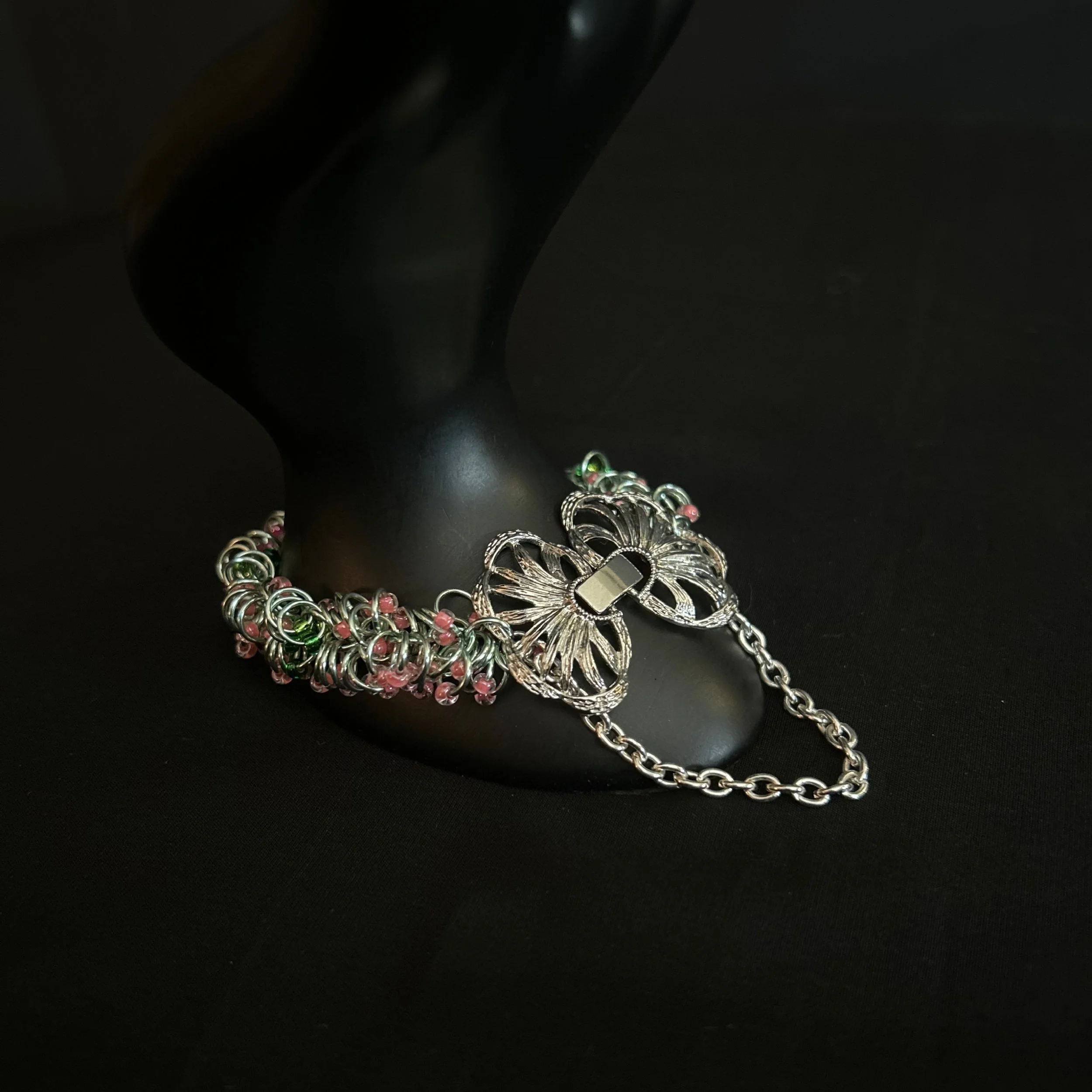 “Bracelet on display prop with the butterfly clasp clearly visible.”
