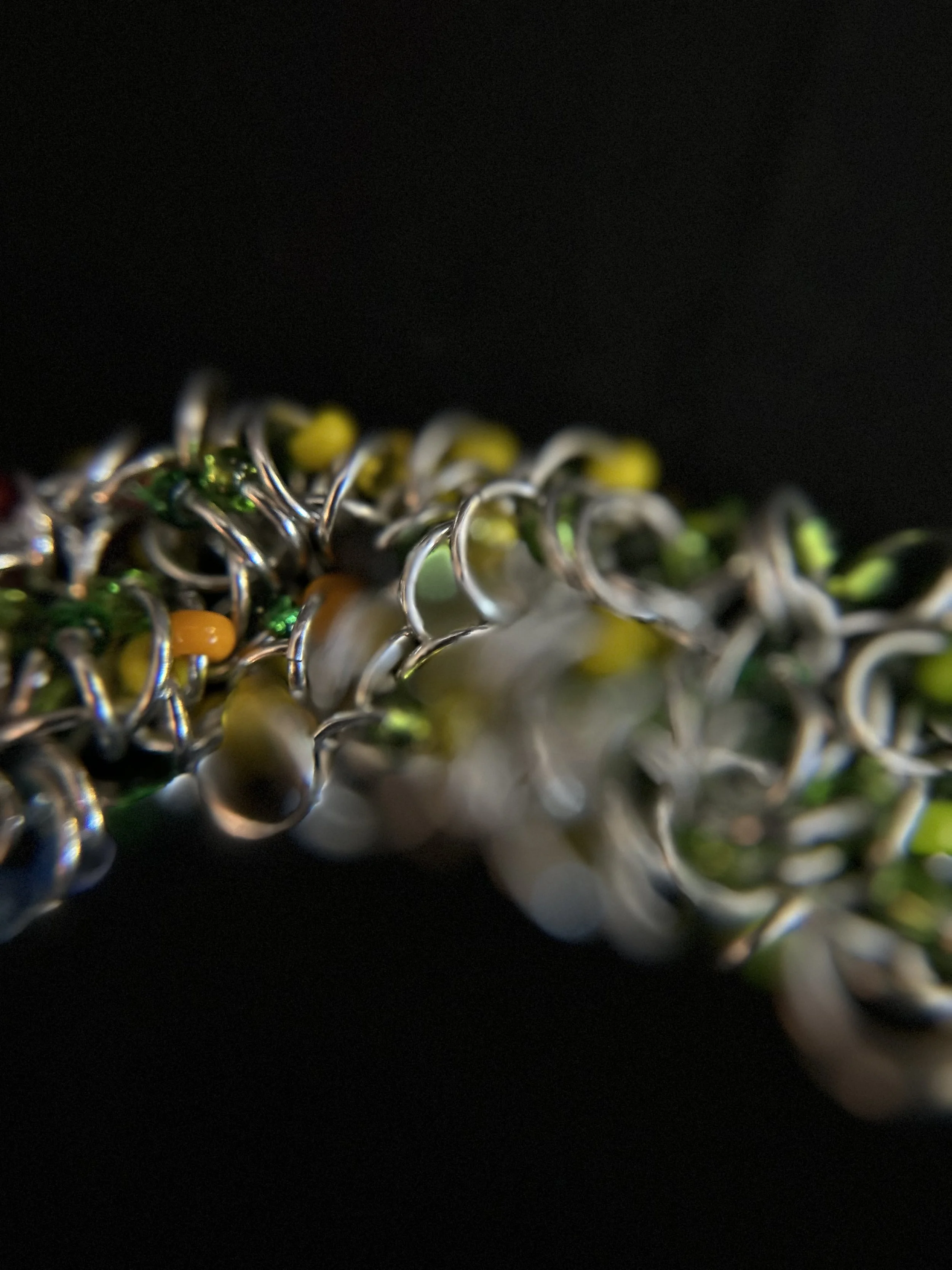 Closeup of the Blue Ridge Summer Bracelet highlighting the detailed chainmaille weave and bold accents.