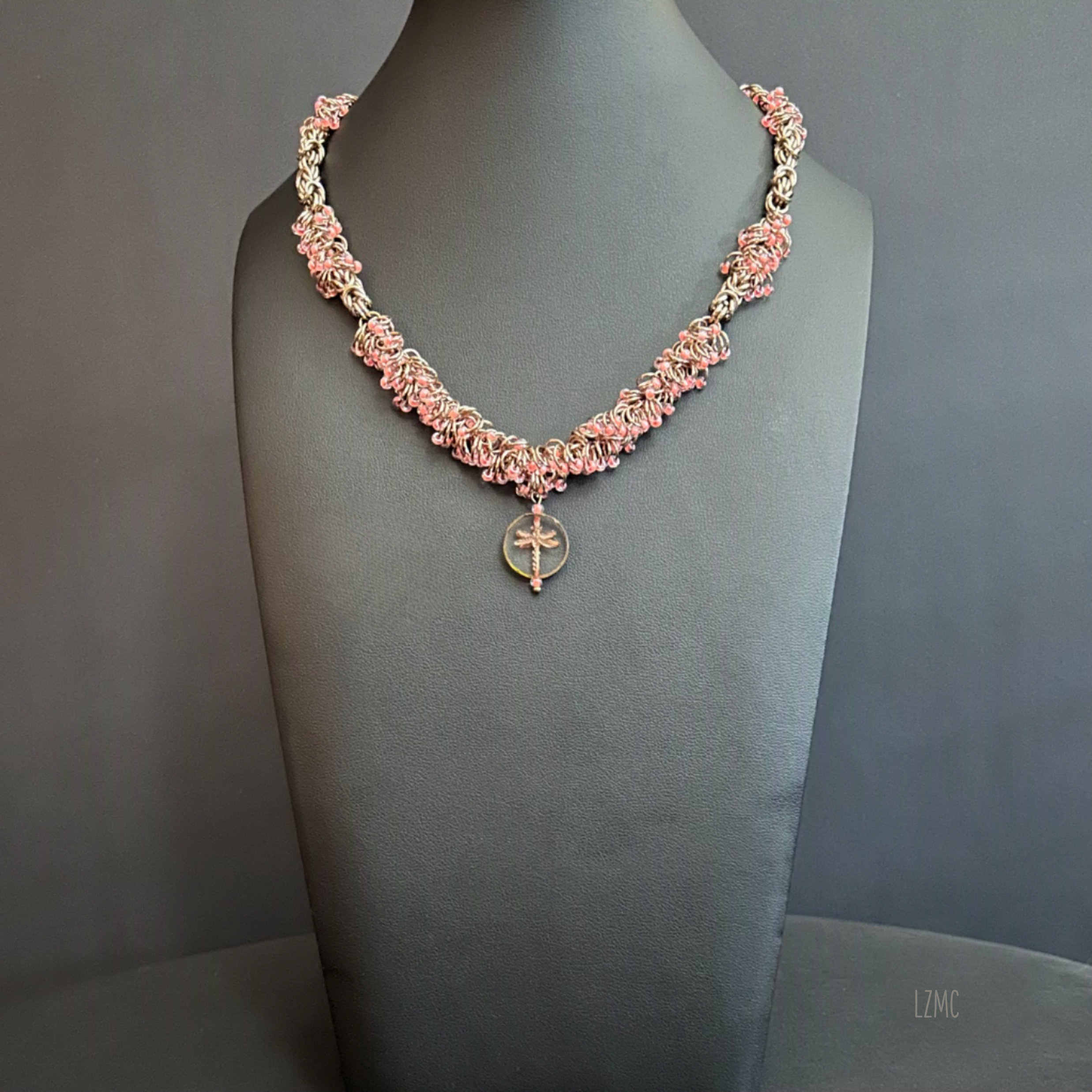 Full view of the 18" Champagne and Pink Caviar necklace, showing the complete chainmaille structure, bead accents, and centered dragonfly focal.