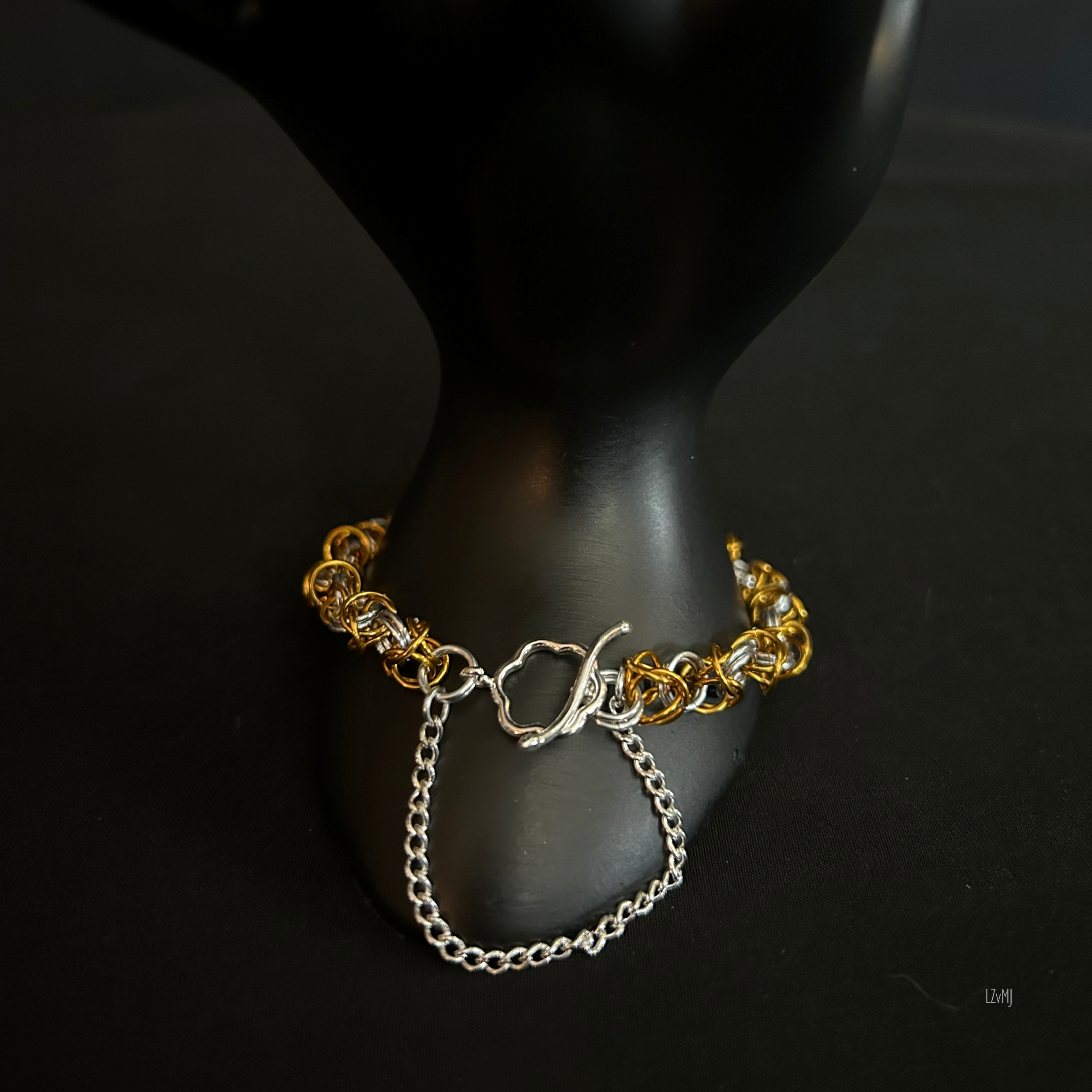 Bracelet on display prop with the silver toggle clasp clearly visible.”