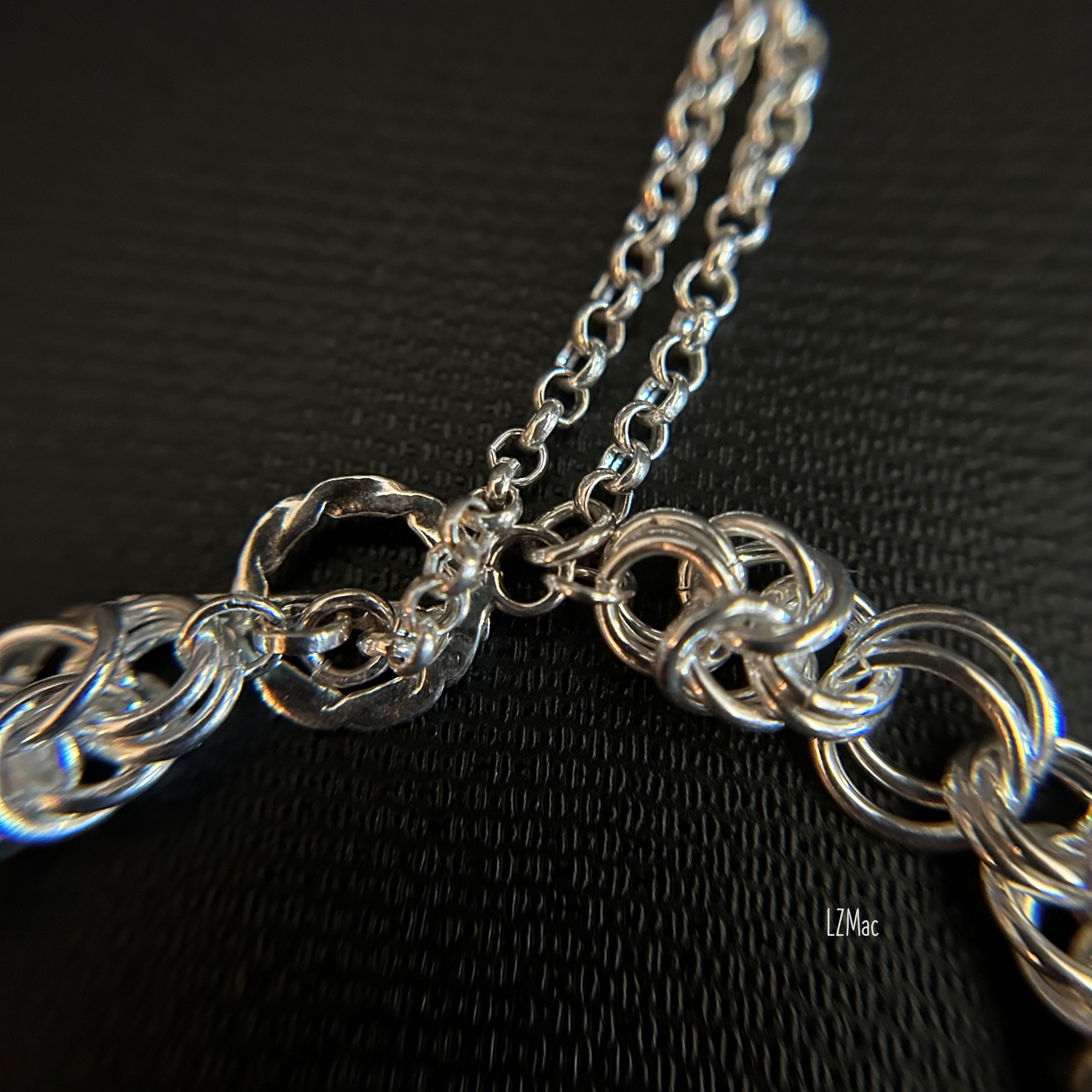 Flat view of the Sterling toggle clasp and safety chain on the Silver Halo Byzantine bracelet.