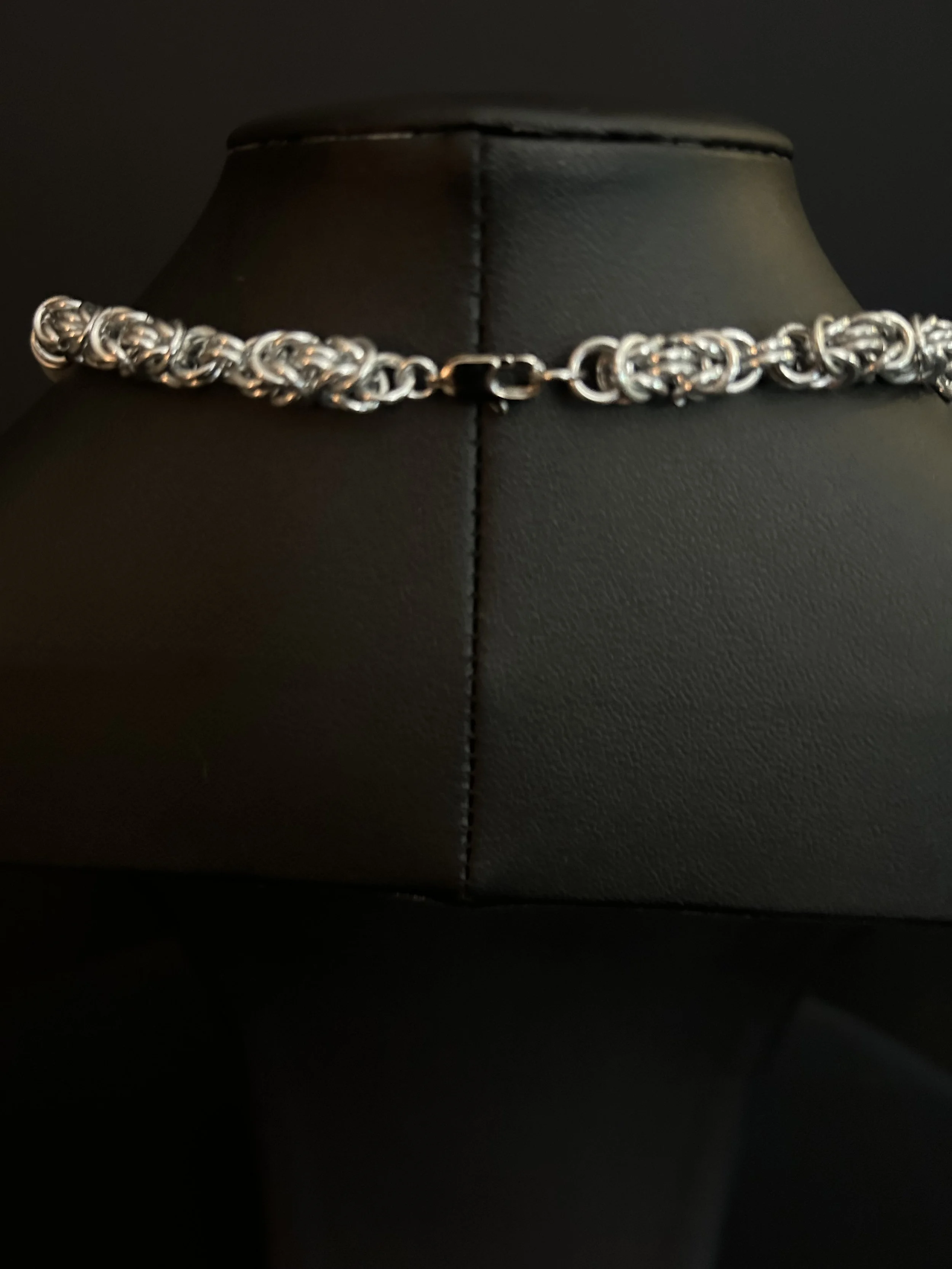 Stainless steel lobster clasp and wirework of the Moonlit Harbor necklace, highlighting clean, modern hardware.