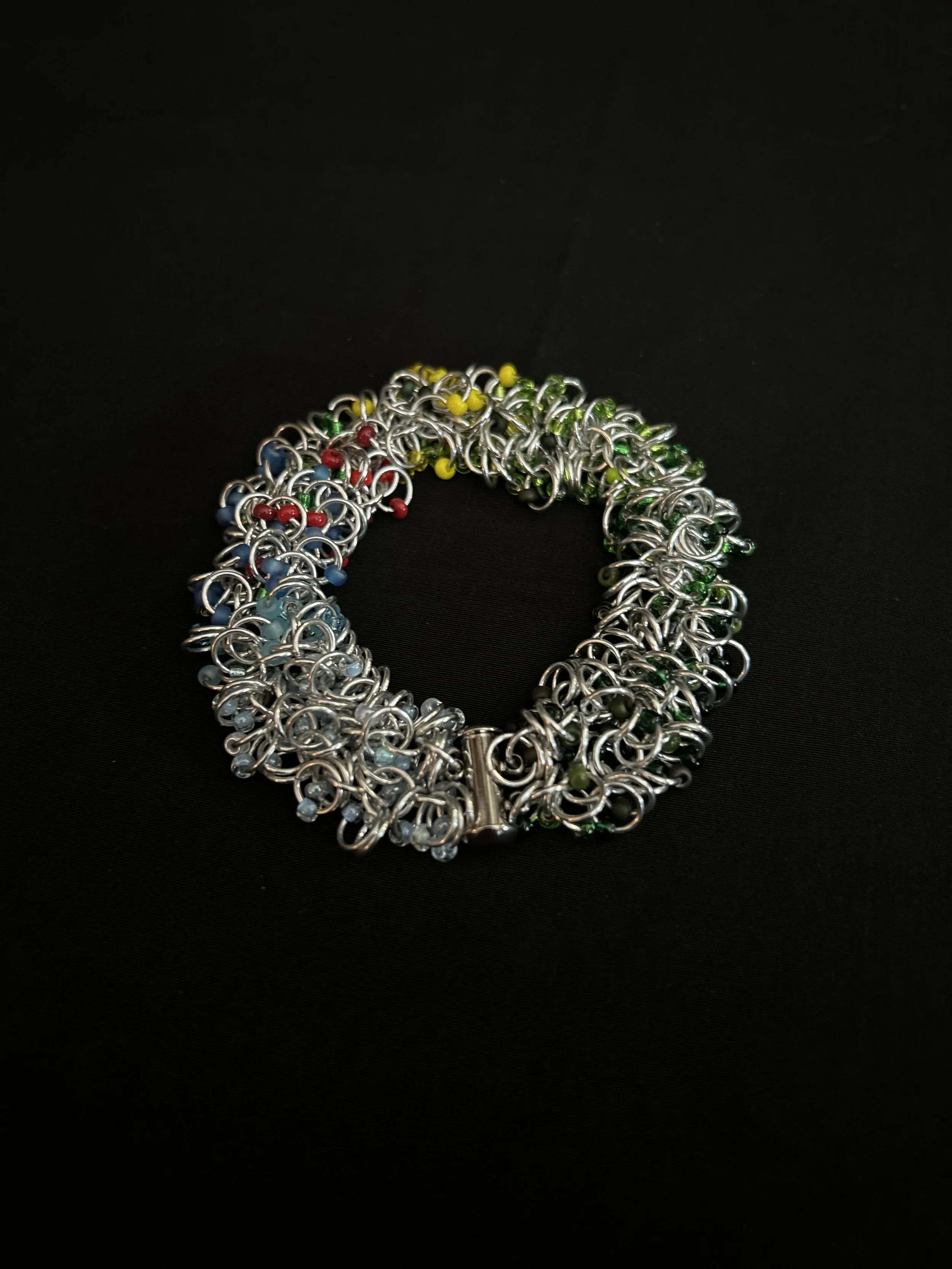 Blue Ridge Summer Bracelet laid flat to show the chainmaille weave and vibrant summer colors