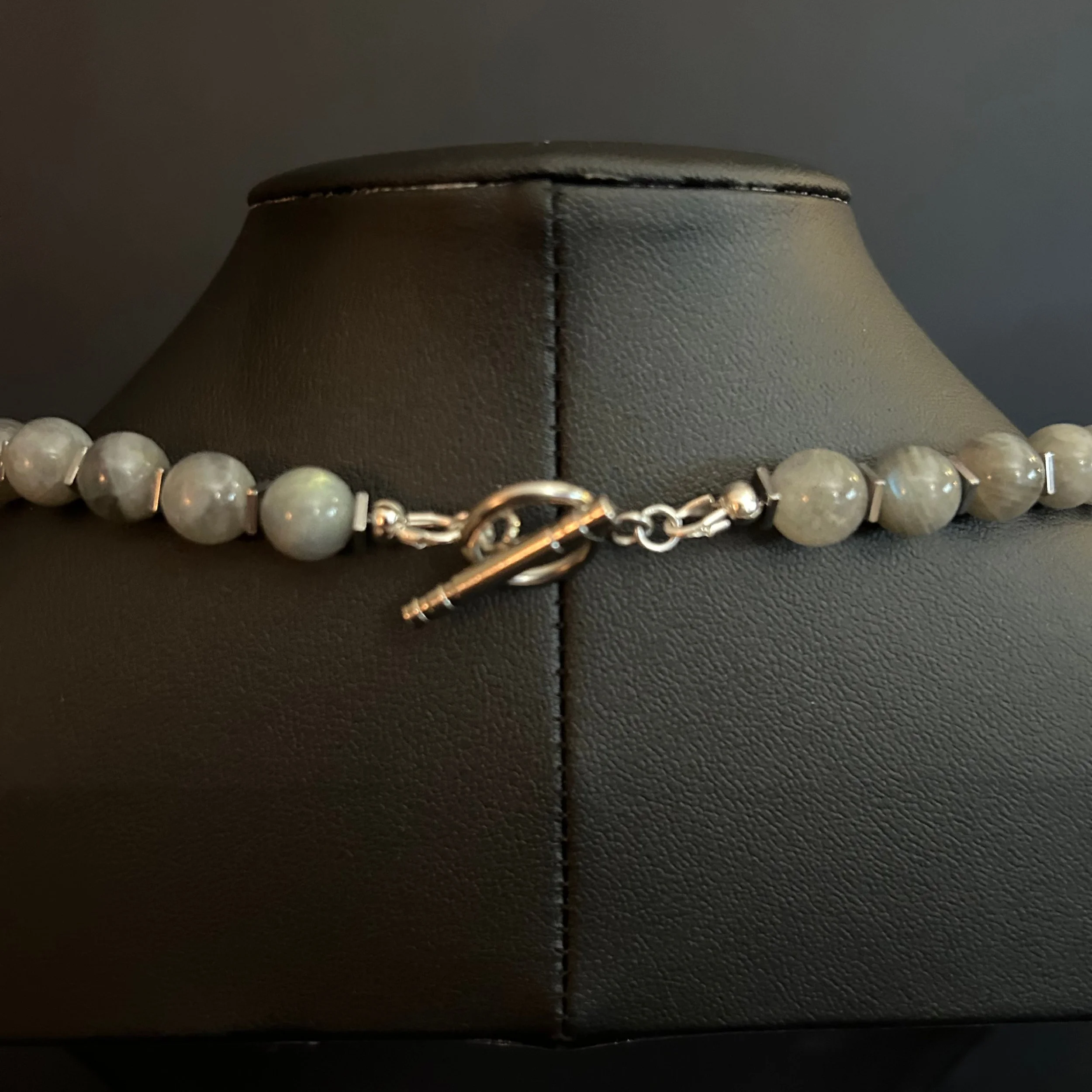 Close-up of the Moonline necklace showing labradorite beads, small metallic spacers, and a silver toggle clasp