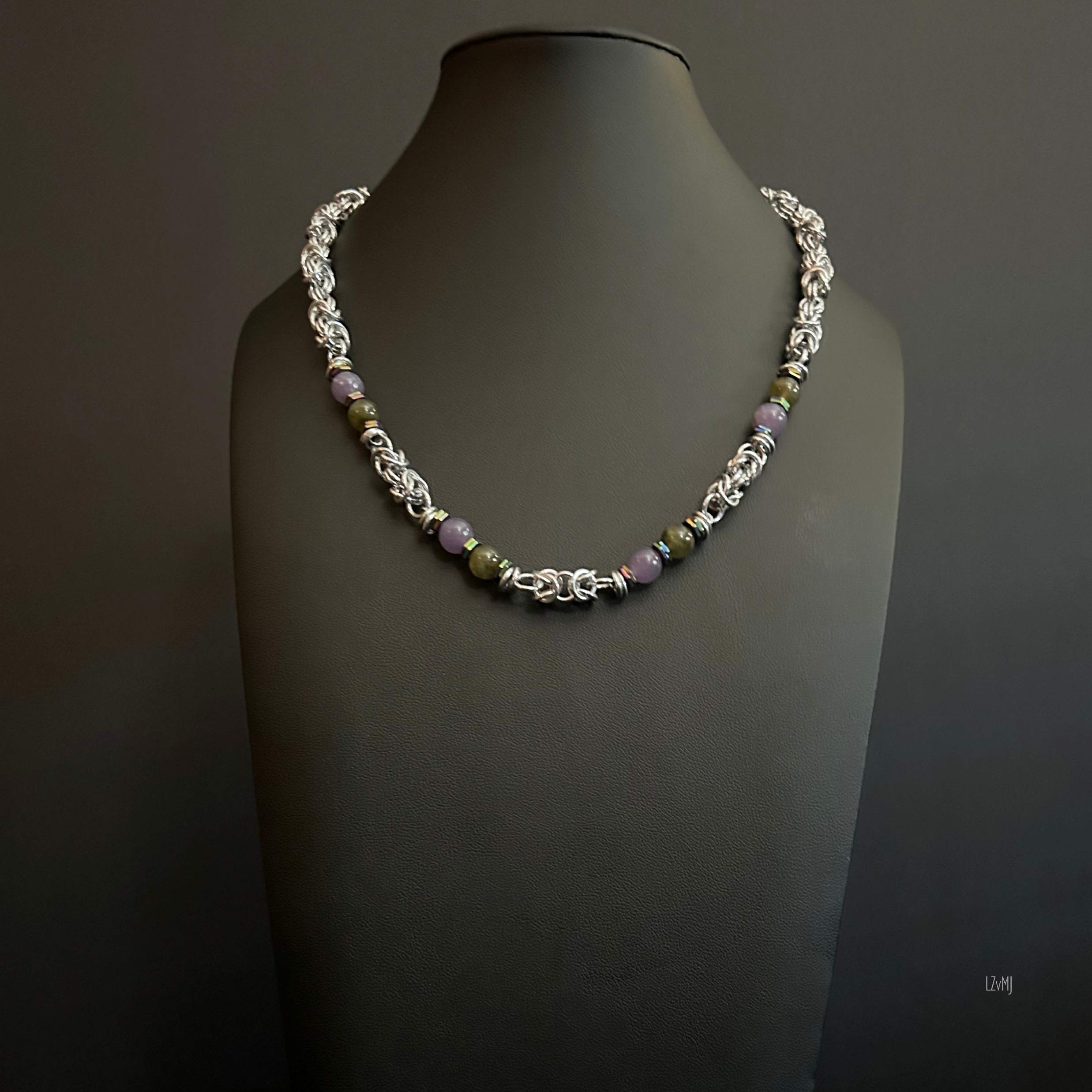 “Full view of the Lumenstone necklace with labradorite and lepidolite beads and silver chain.”