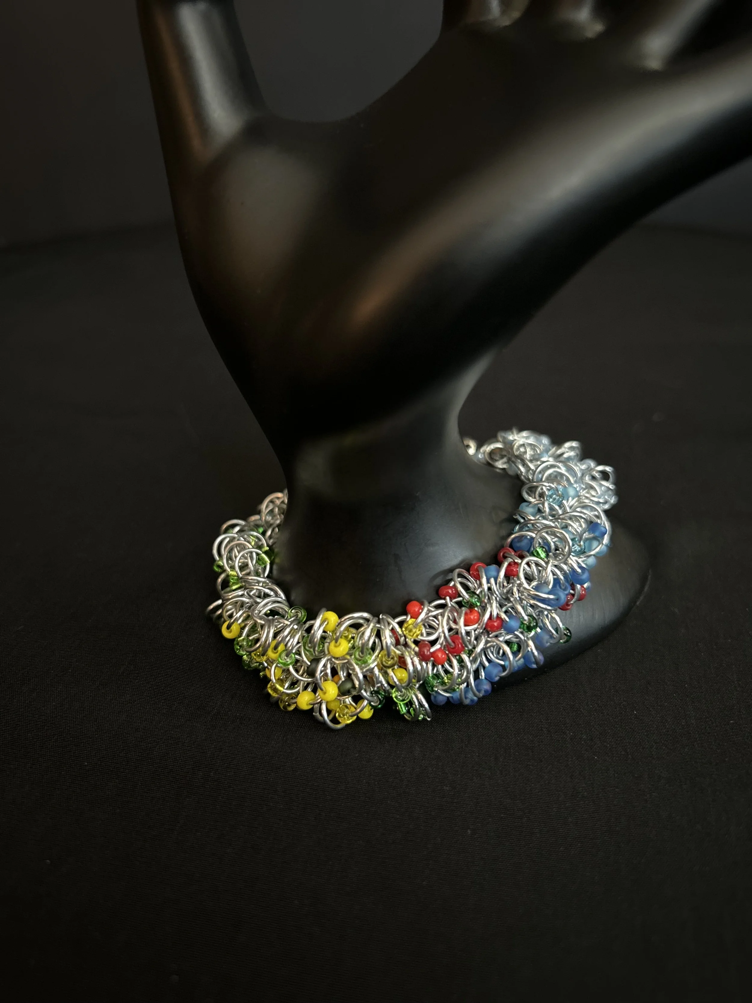 Blue Ridge Summer Bracelet draped over a display prop showing its bright summer palette.