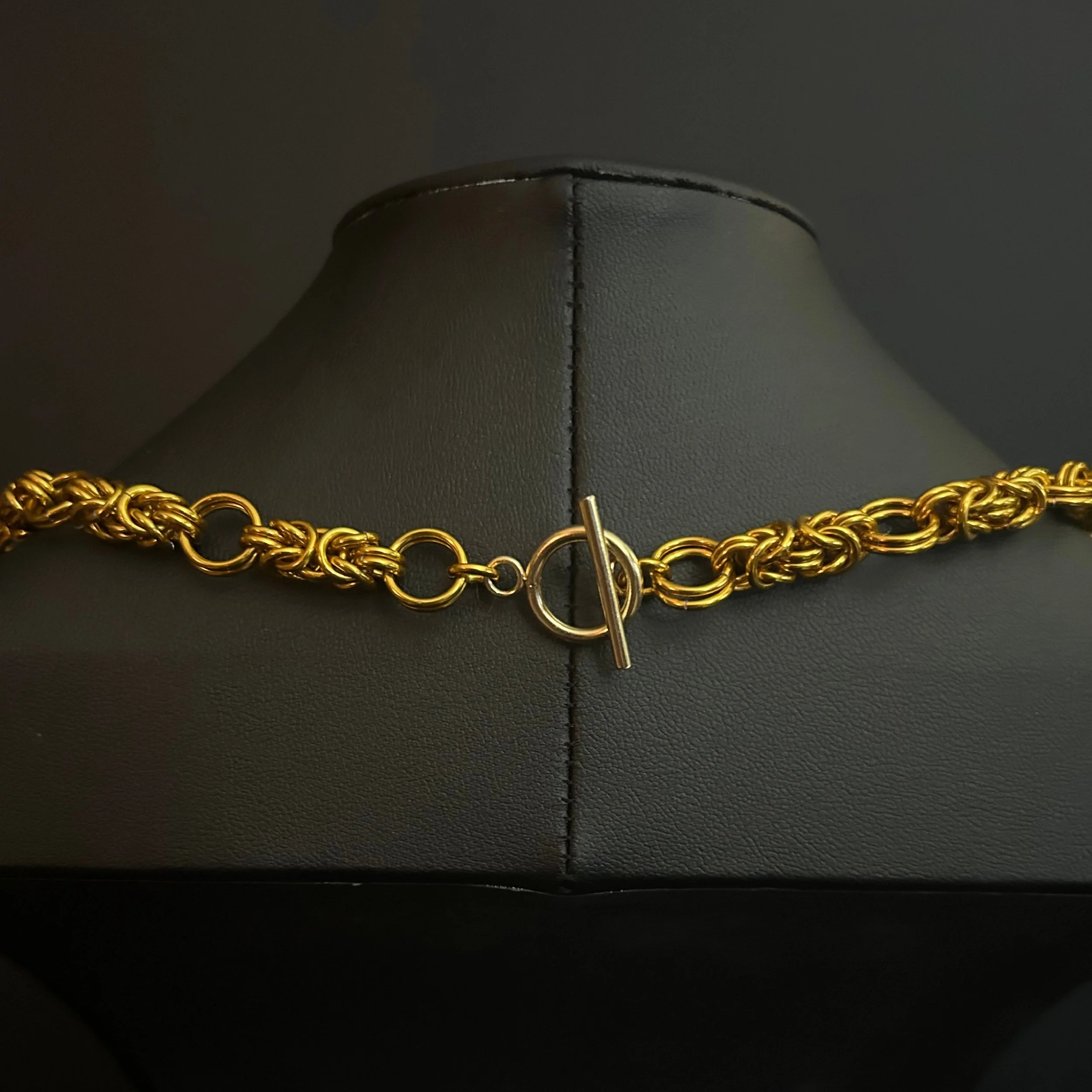 “Close-up of the gold‑tone toggle clasp and connecting rings.”