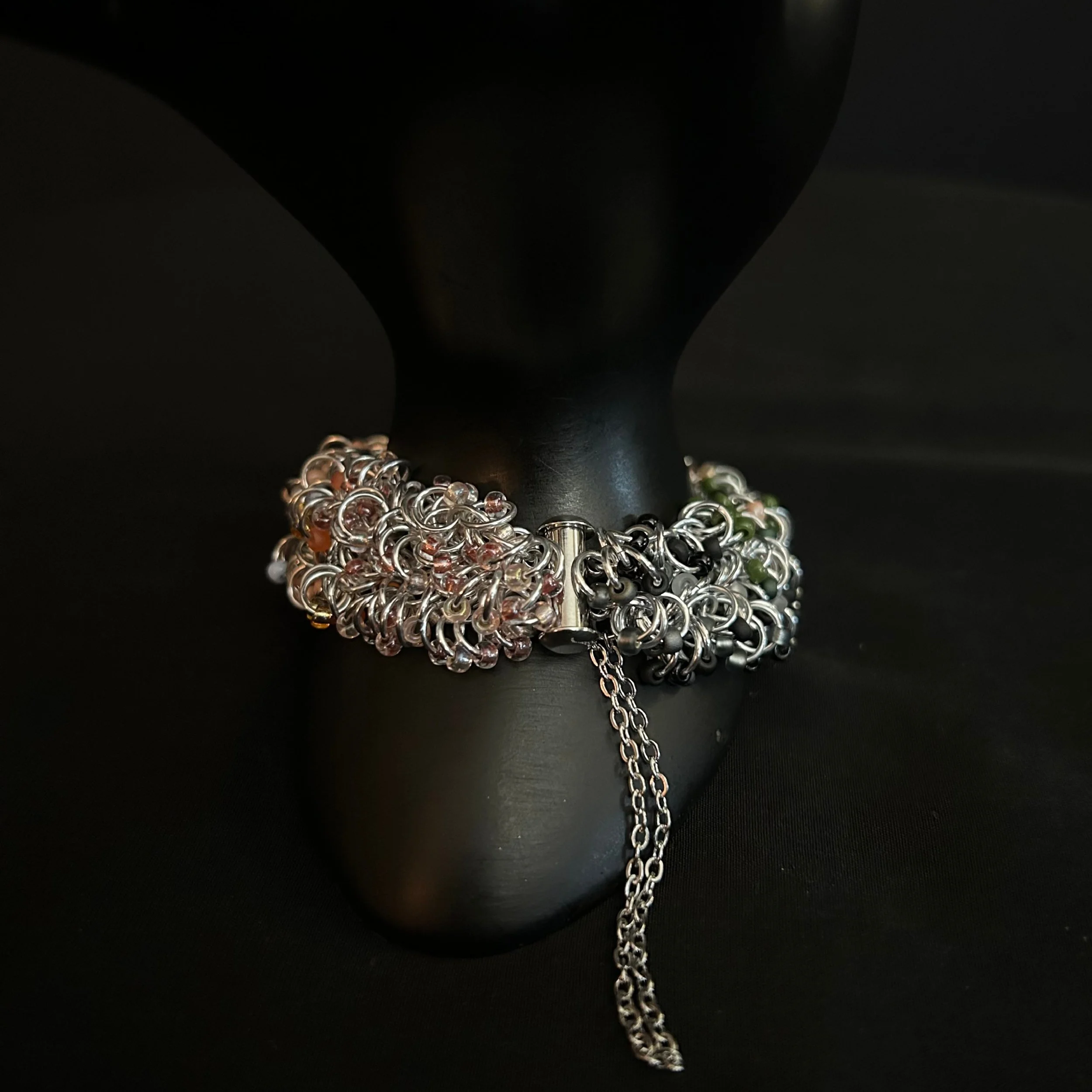 “Bracelet on display prop with the clasp and safety chain clearly visible.”