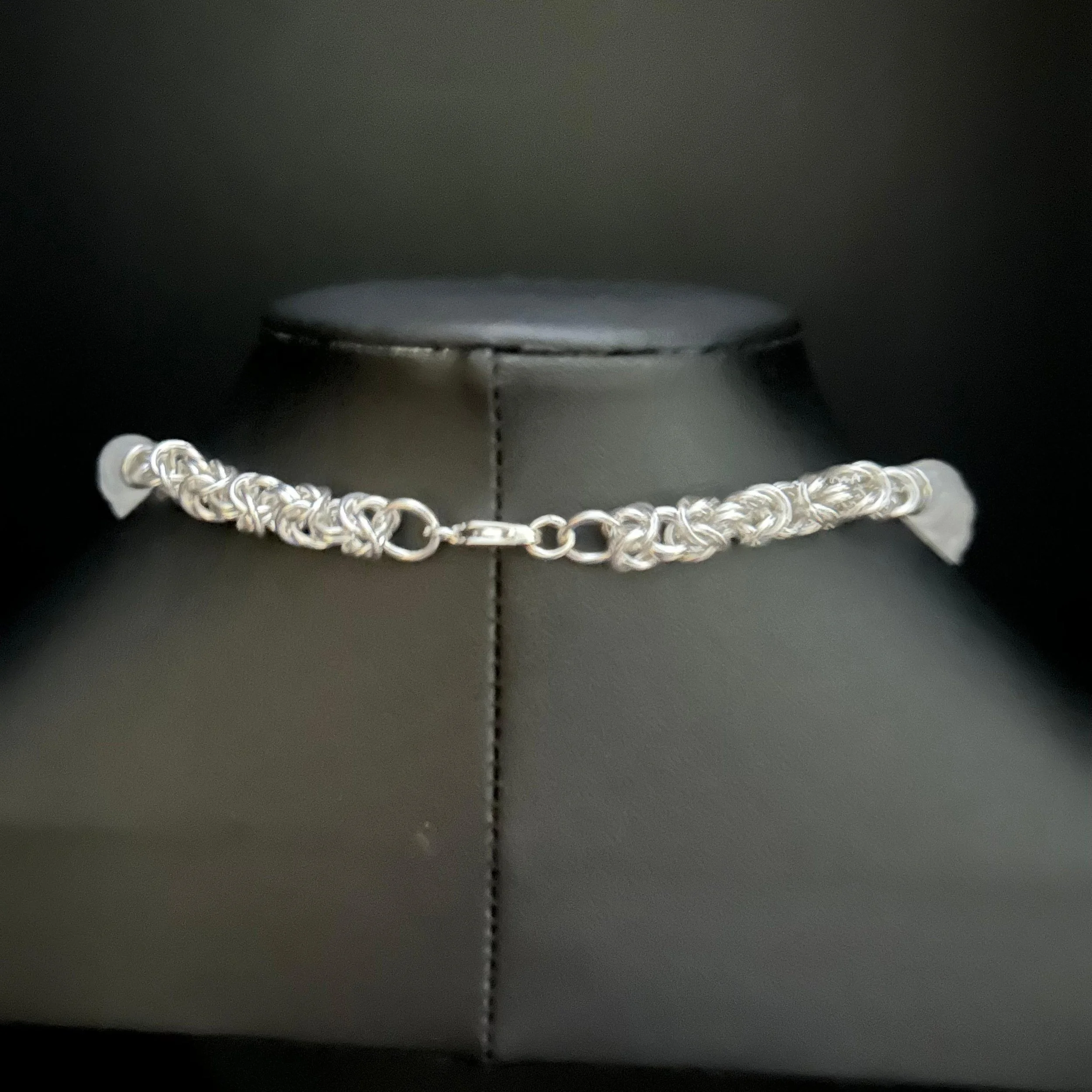 Sterling silver clasp and finishing details of the Silver Starlight necklace shown in close-up.