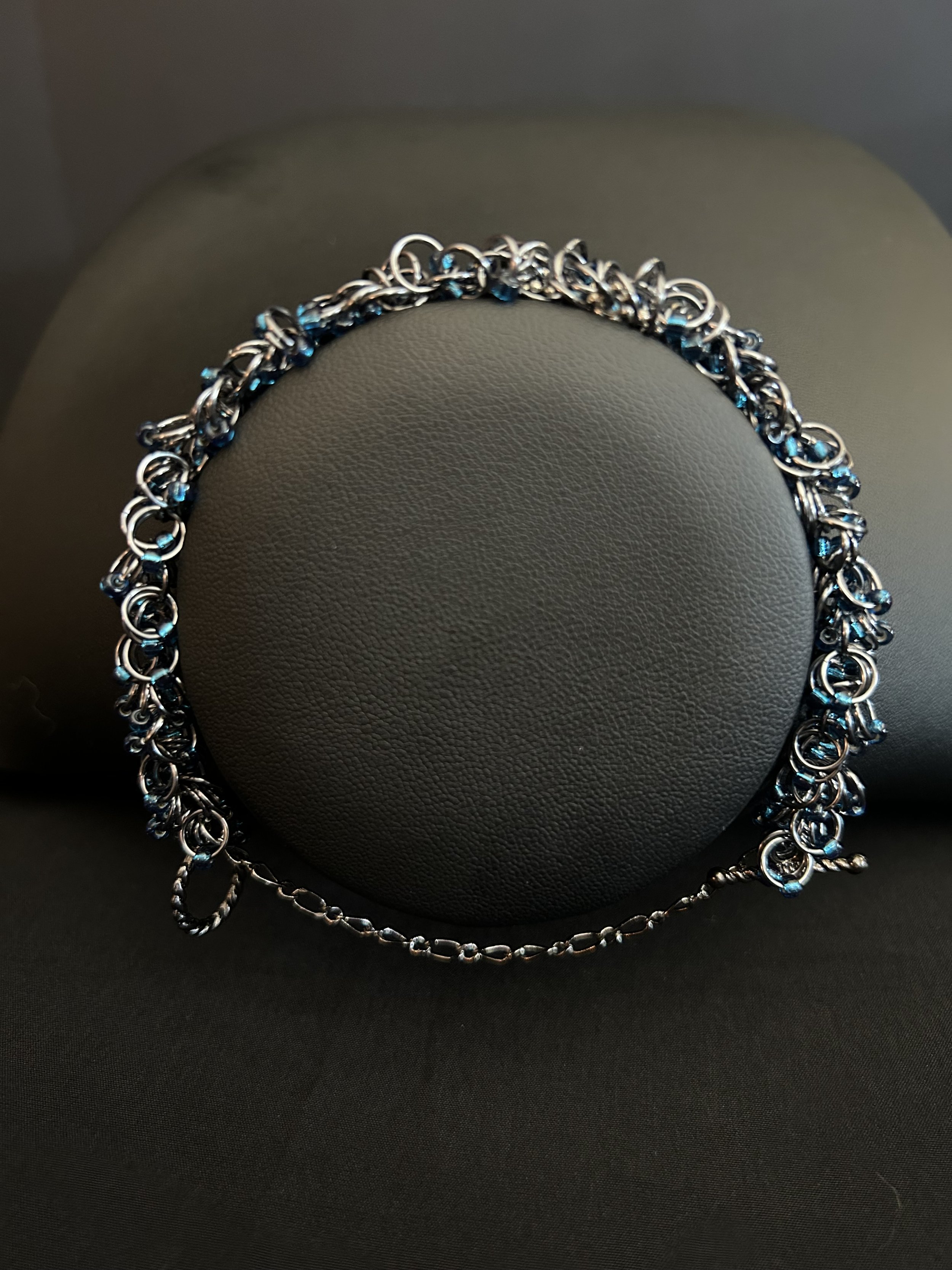 Midnight River bracelet displayed on a jewelry bust, showing how the Black Ice metal and midnight blue beads catch the light