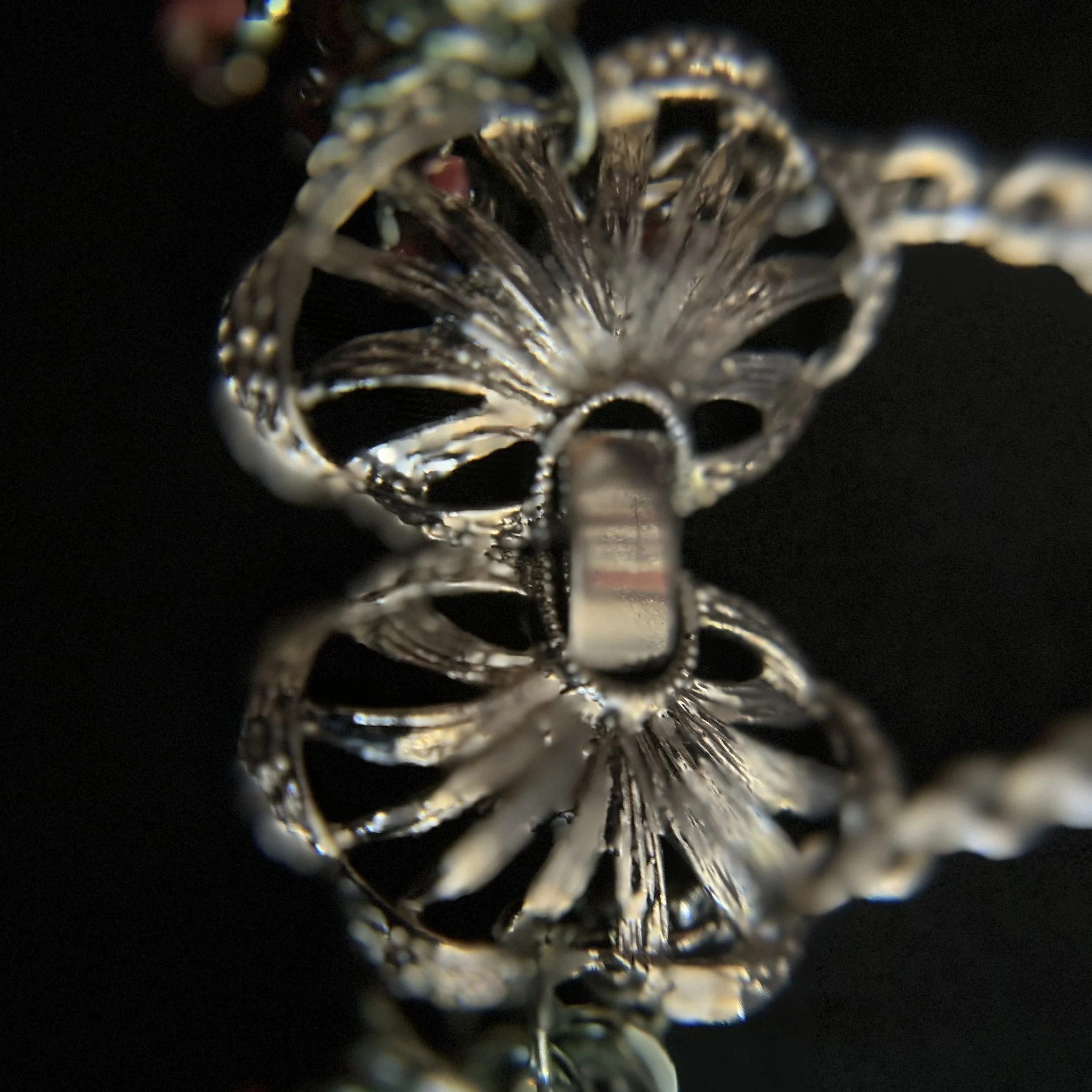 “Close-up of the butterfly clasp and connecting rings.”