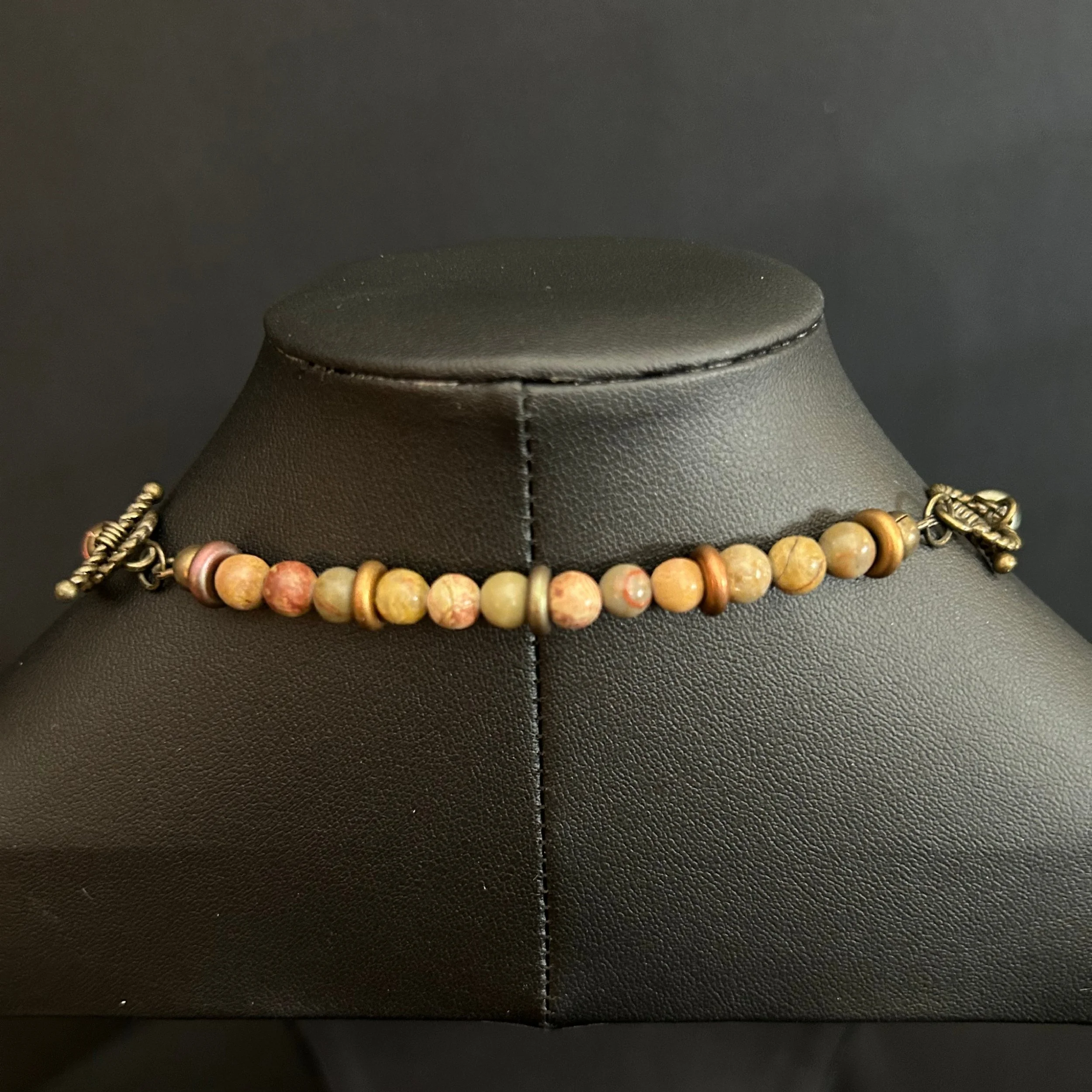 “Bronze toggle clasps on both the necklace and extender shown together.”