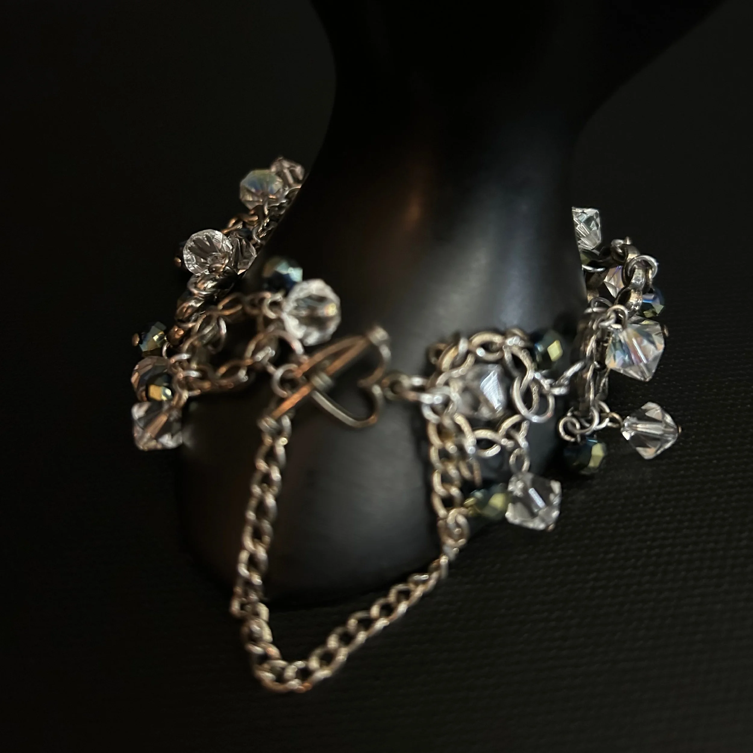 Close-up of the antiqued silver toggle clasp and connecting twisted rings