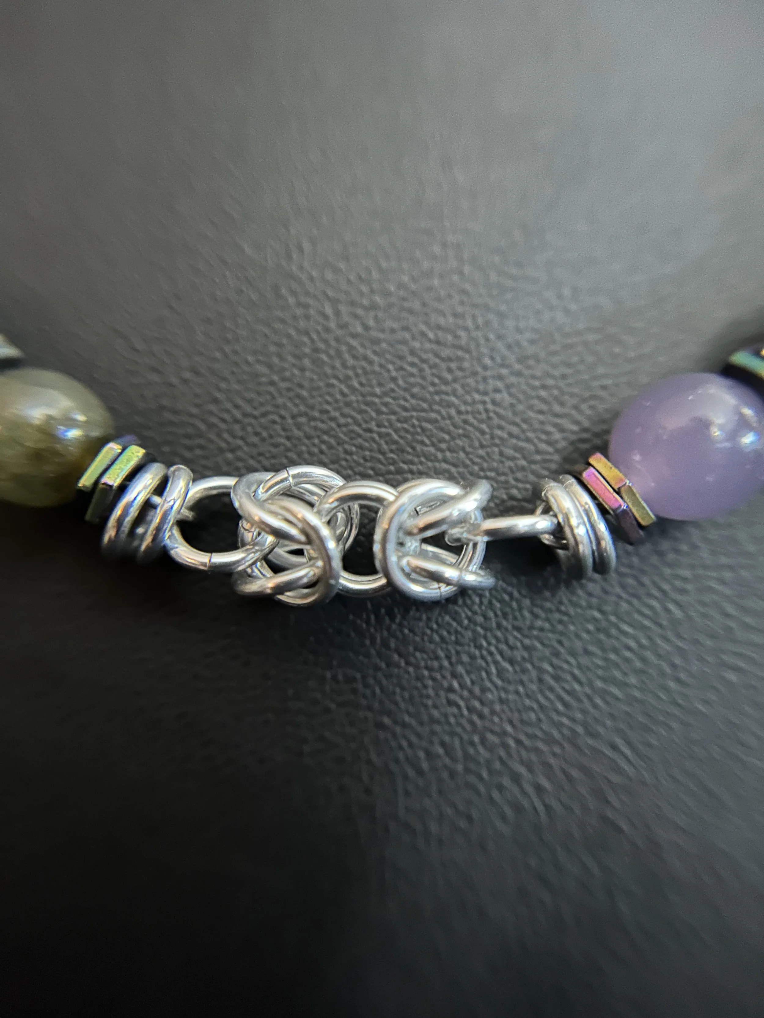 Bright aluminum chainmaille section showing weave detail and texture.