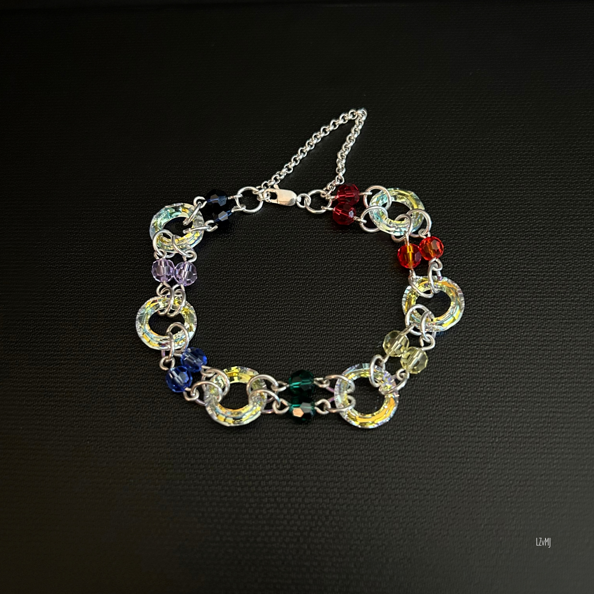 Full view of a sterling silver chainmaille bracelet featuring Swarovski crystals