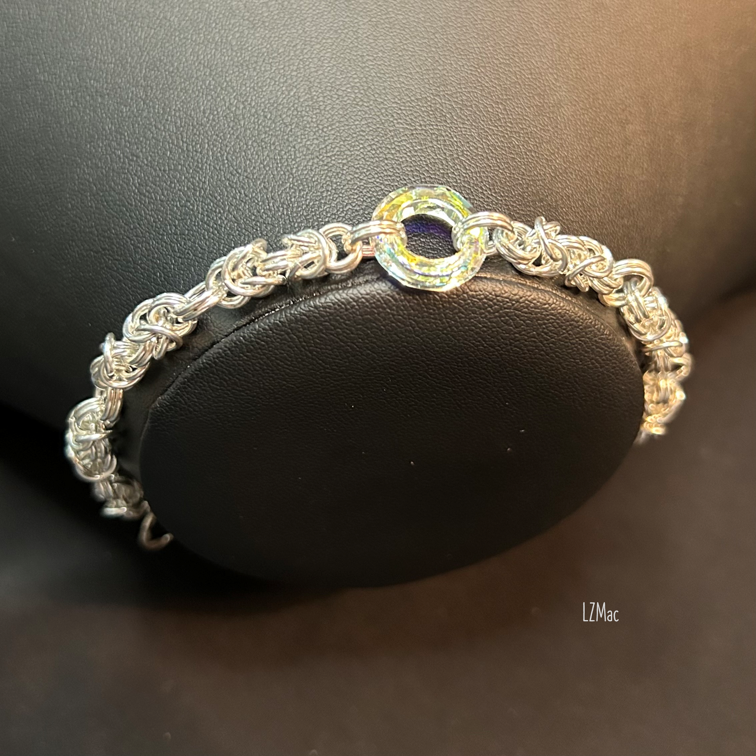Silver Halo Sterling Byzantine bracelet shown on a jewelry bust with its Swarovski crystal halo centerpiece.