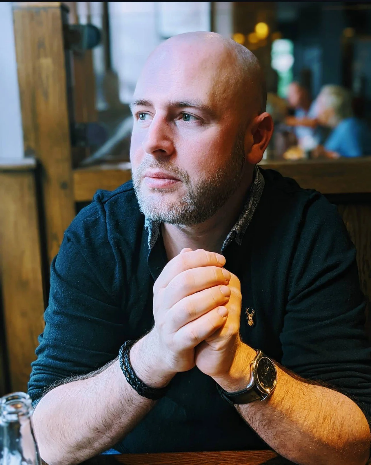 Christopher Murray sitting and looking out of the window.