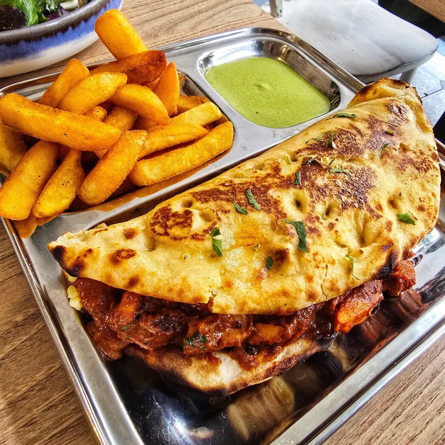 Tried the butter chicken naanwich at White Tiger earlier today, their Sunday special, and it more than delivered. Big, messy, full of flavour.

A hell of a feed as well. Gave it a solid effort but it won in the end.

Glorious sunny Sunday in Ramsey. 