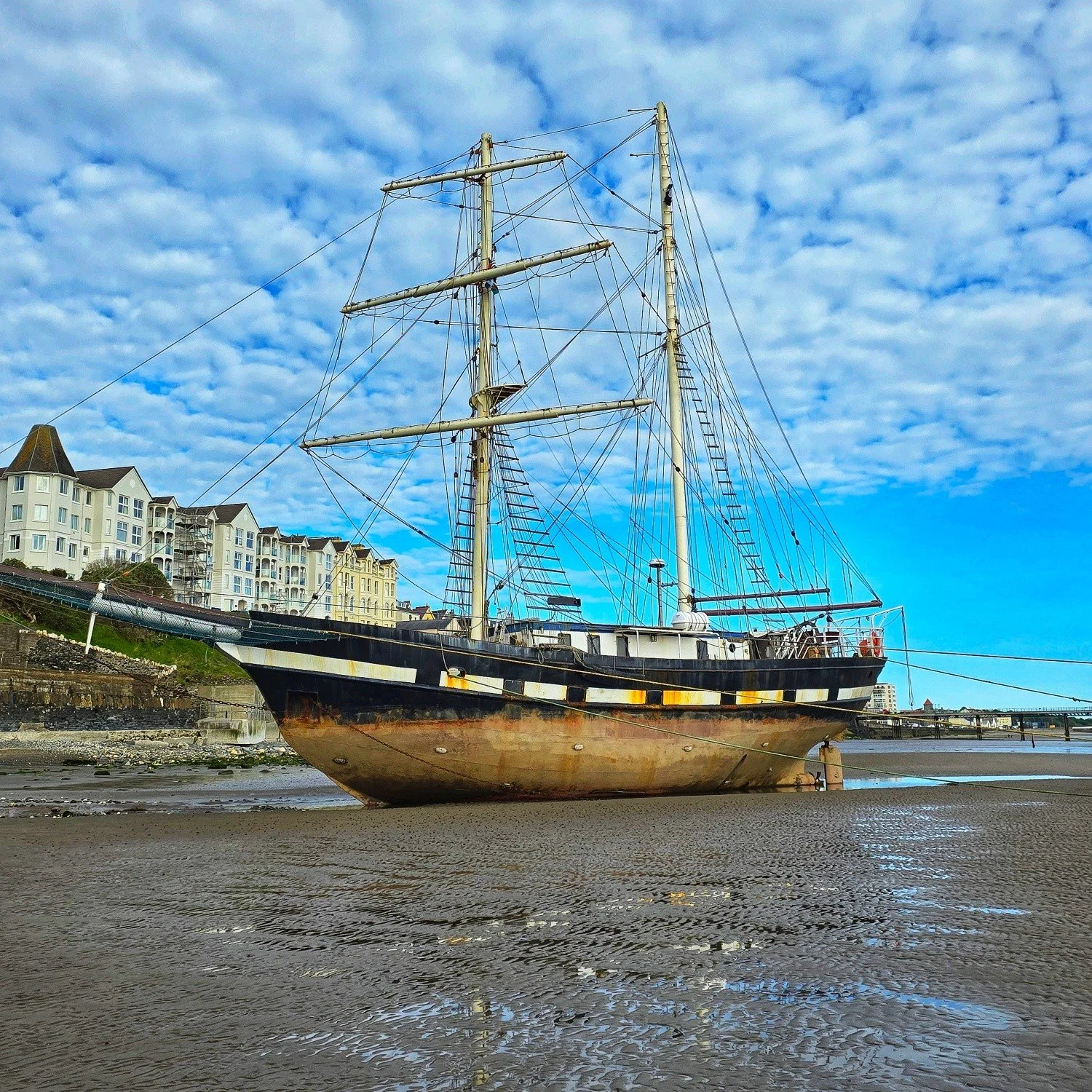 Early Saturday morning wander through Ramsey just as the town was waking up.

I was down having a skeet at the beached tall ship and couldn't resist taking another photo. Still quite a striking sight sitting there on the sand, waiting for the tide to