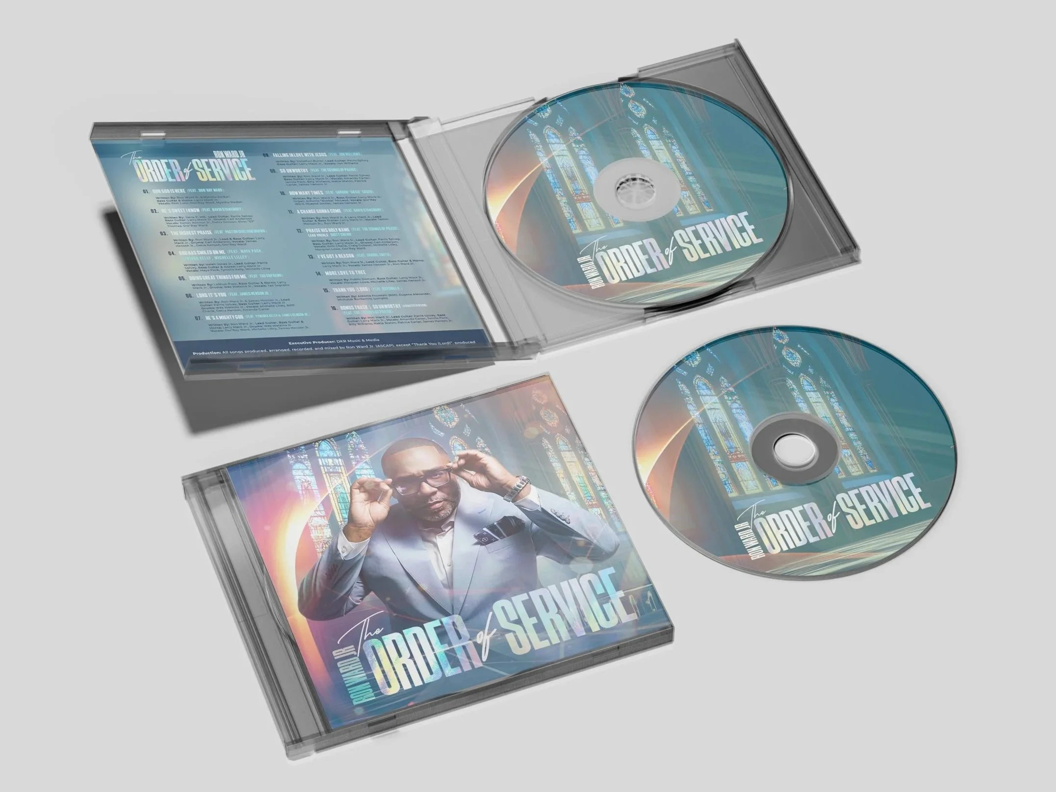 Two CD cases and two CDs for an album titled 'The Order of Service.' One CD case shows a man adjusting his glasses, and the back case shows song lyrics with a church stained glass window background.