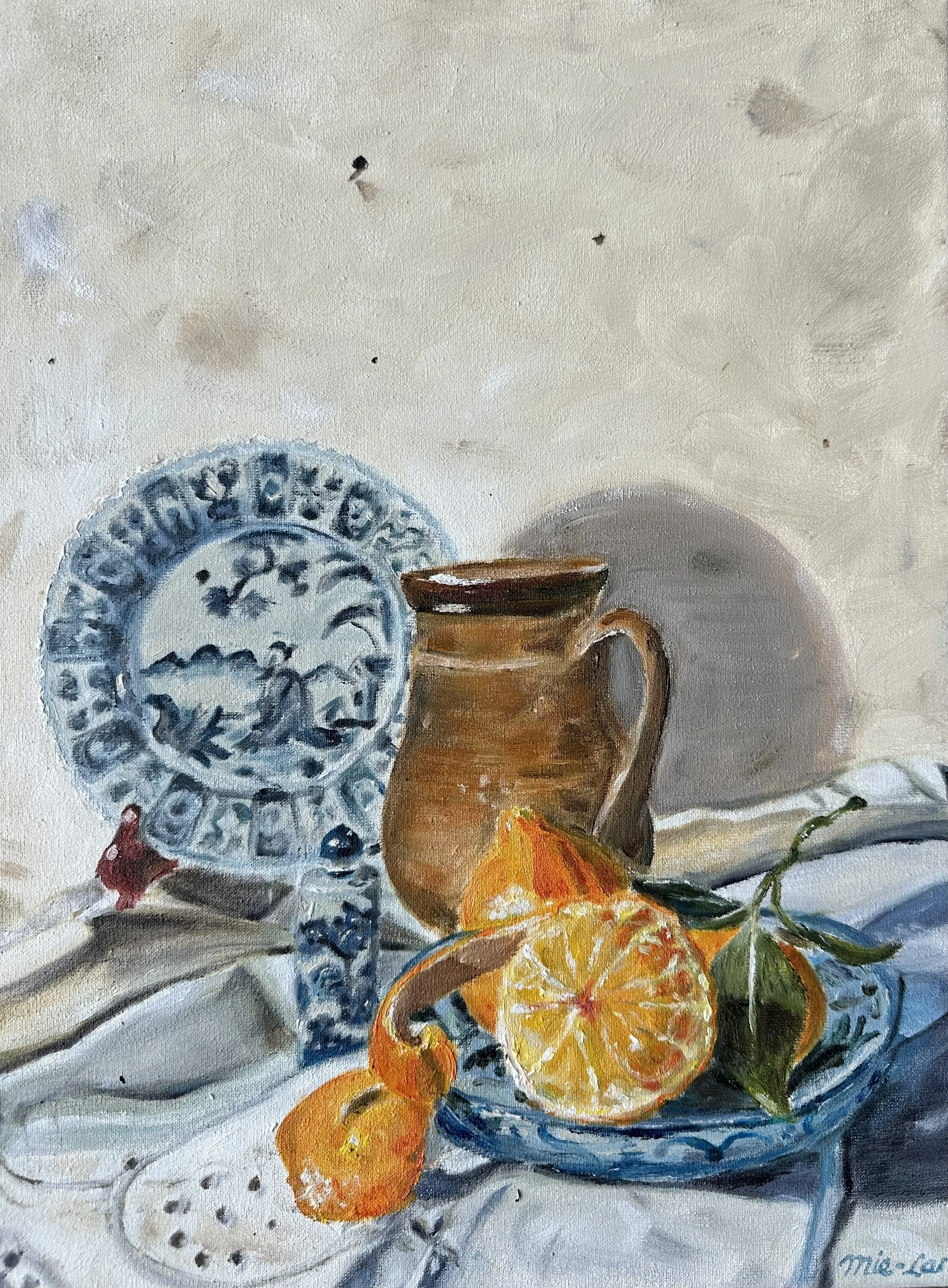 NAME: Minneola DESCRIPTION: This still life complements the painting The Jug. Featuring the same recognizable earthenware jug. At the center of the composition lies a minneola on a small plate, its vibrant color drawing the eye. Beside it rests a Chi