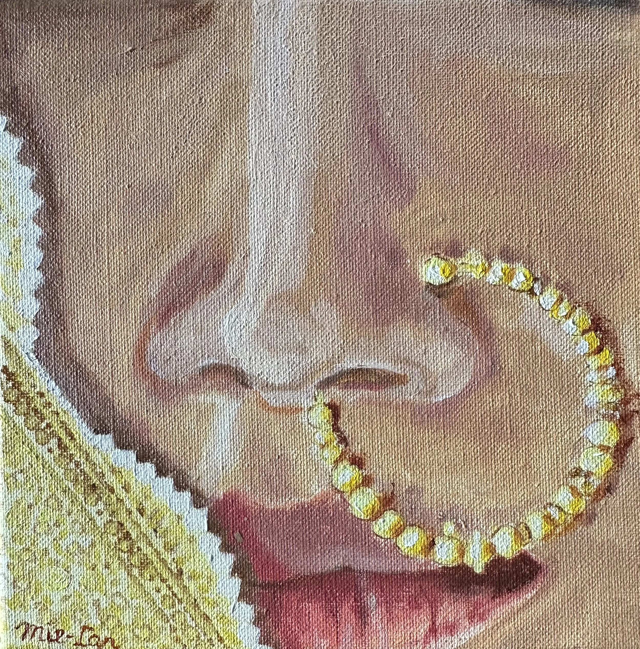 NAME: Nose DESCRIPTION: A close-up glimpse of an Indian woman’s nose adorned with a stunning gold nose ring captures the beauty and cultural richness of traditional jewelry. The ring, adorned with delicate charms, draws attention with its intricate d