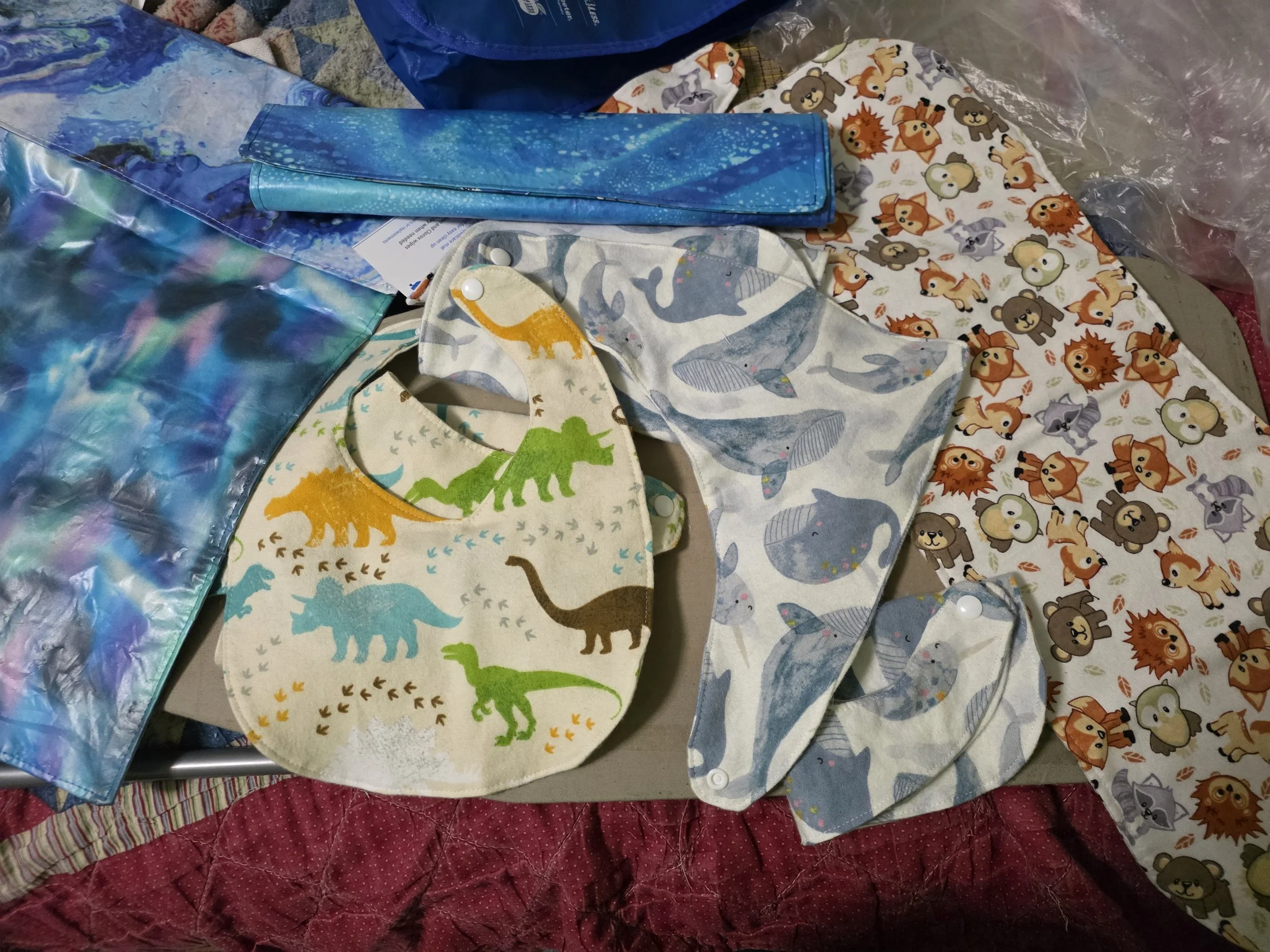 Various baby bibs and changing pads