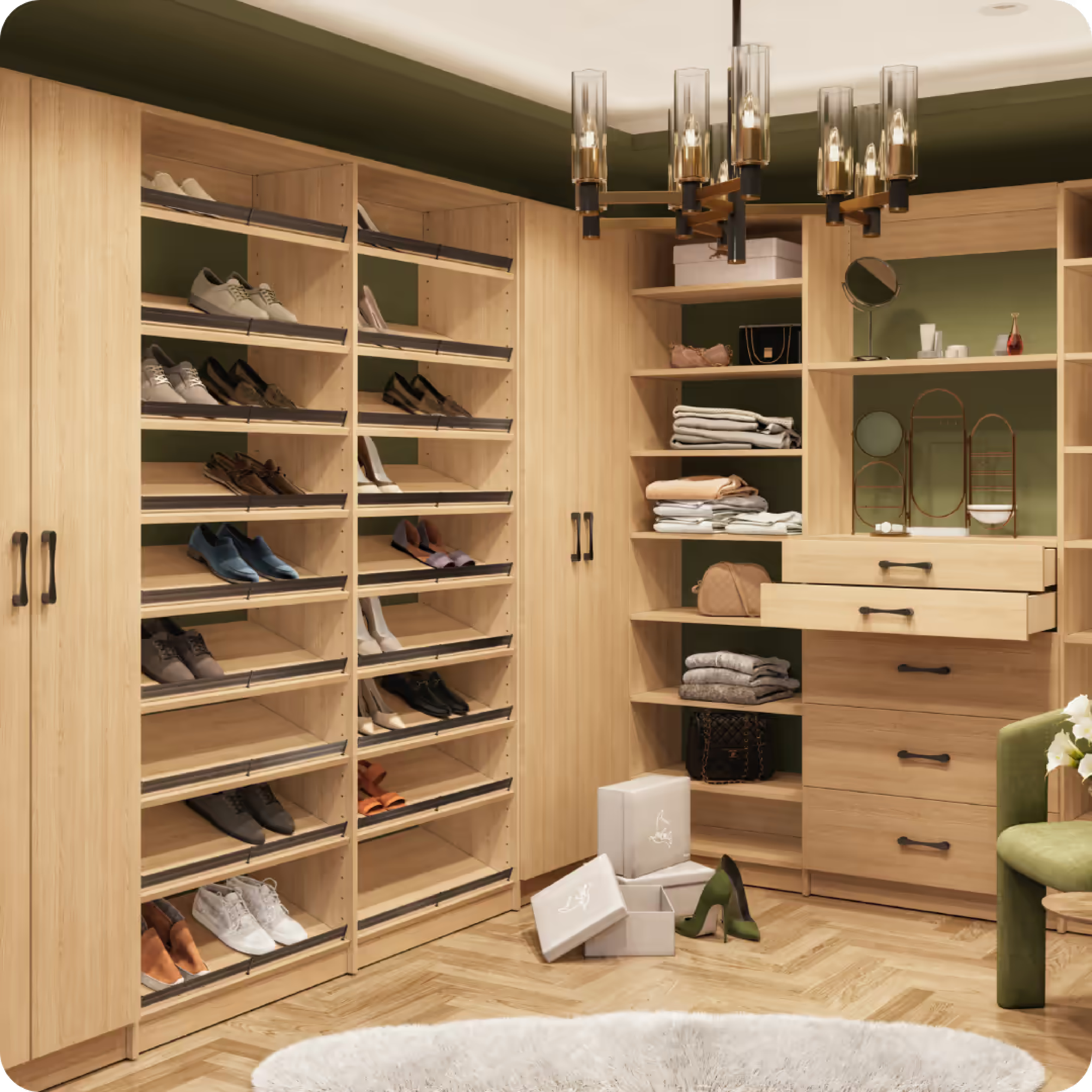 A walk-in closet with wooden shelving units holding shoes, folded clothes, bags, and accessories. There are boxes on the floor, a pair of high-heeled shoes, and a green velvet armchair nearby. A dark chandelier hangs from the ceiling.