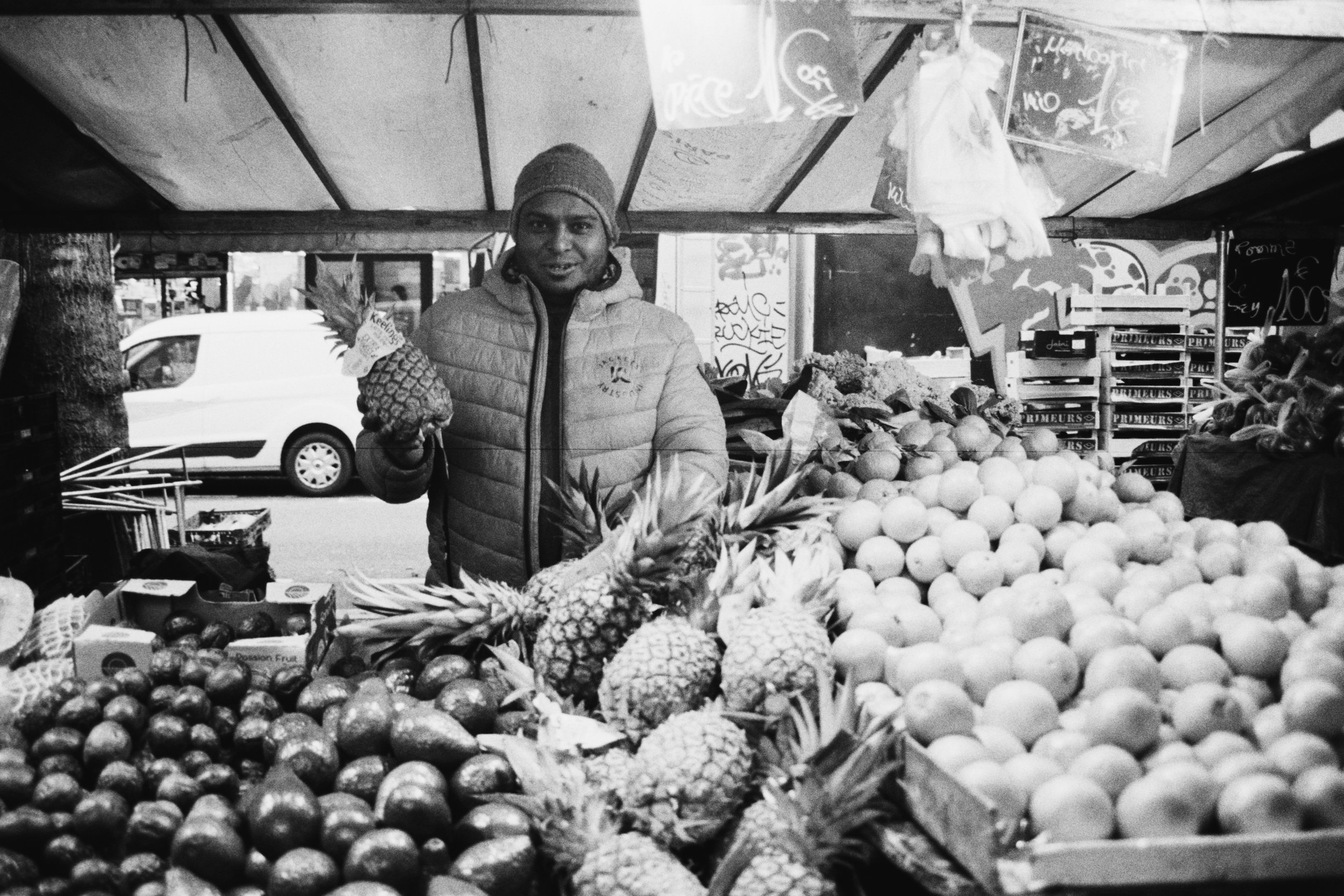A vendor and his pineapple. Barbès, 14022026.