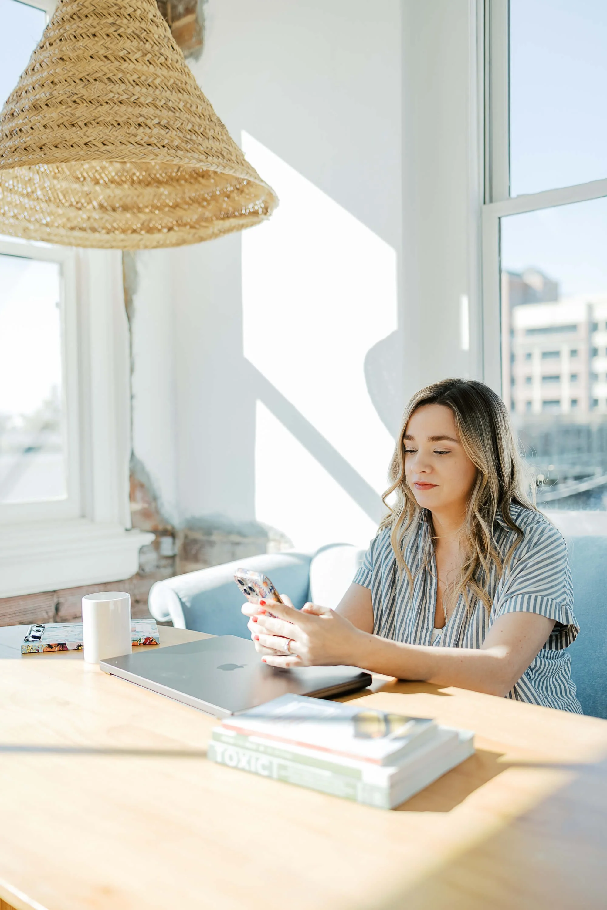 Functional nutrition consultation lifestyle, woman reviewing wellness plan in bright coastal space