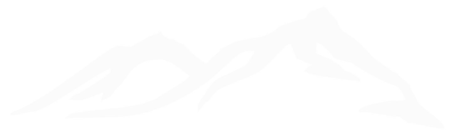 Silhouette of a mountain range with snow-capped peaks.