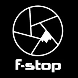 A circular logo with various geometric shapes inside and the words 'F-stop' beneath it.