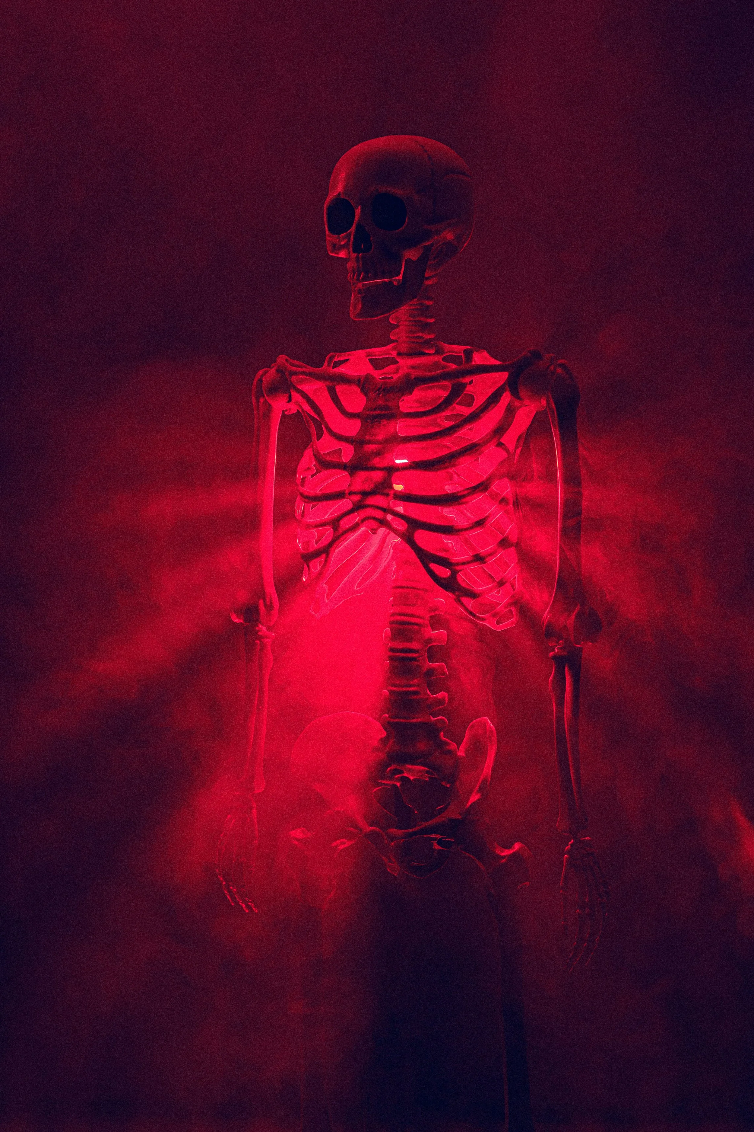 skeleton with red light beam emanating from its chest