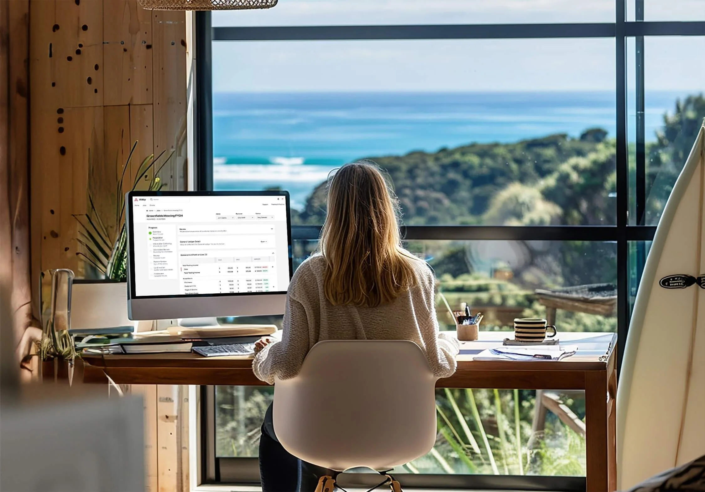 Business professional working at a desk in a modern office.