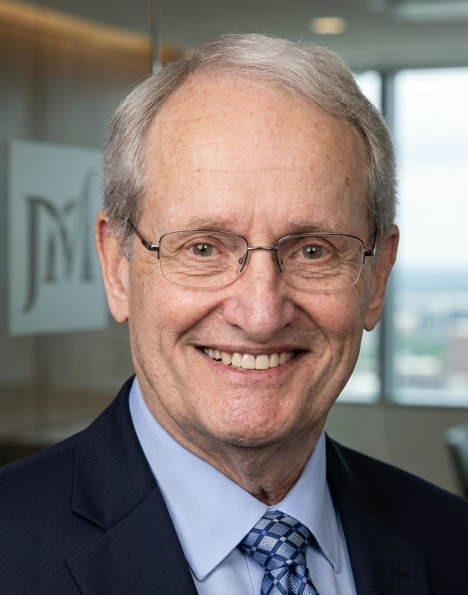 Smiling elderly man with glasses in business suit in office